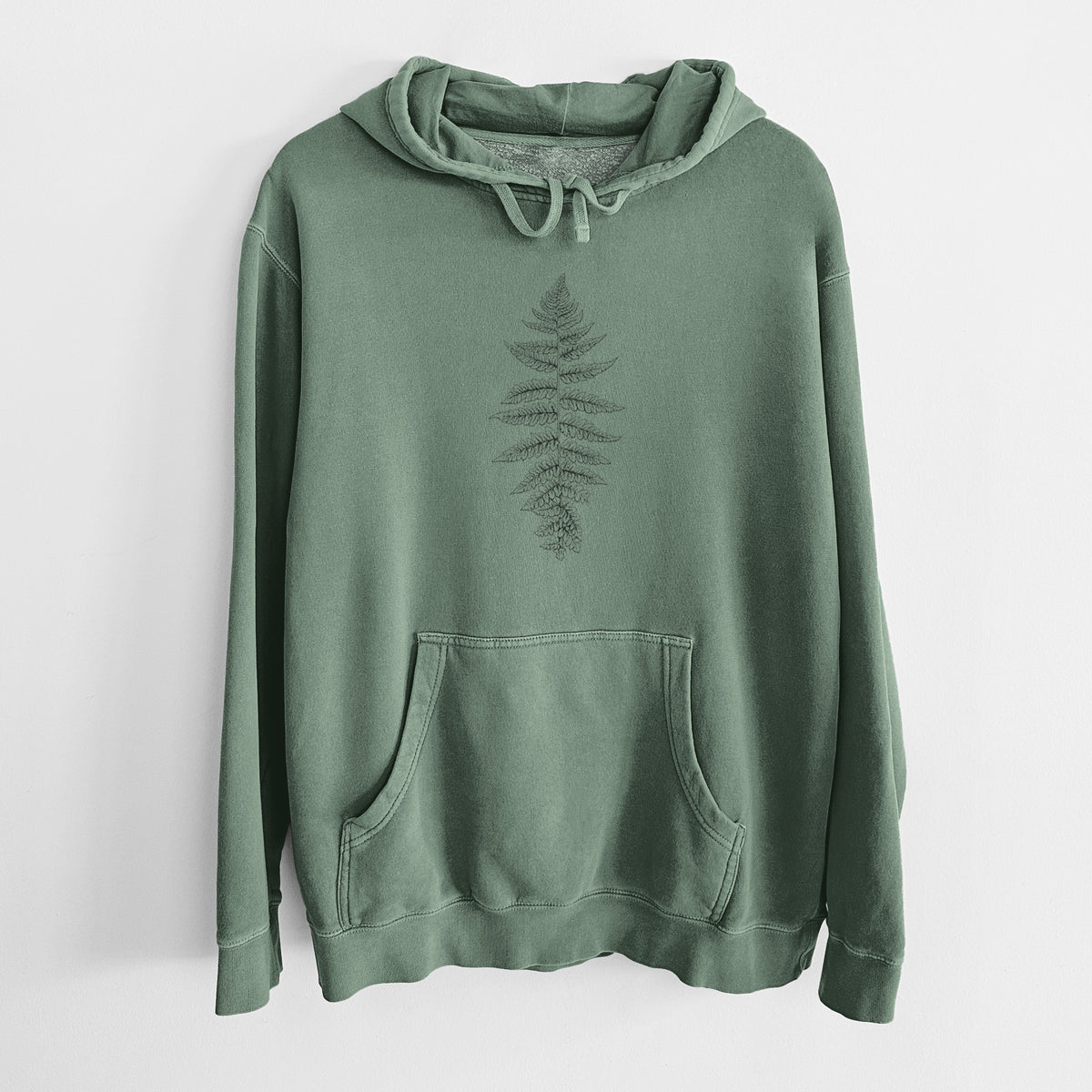 Alpine green pigment dyed hoodie laid flat, printed with a black ink illustration of a lady fern frond.