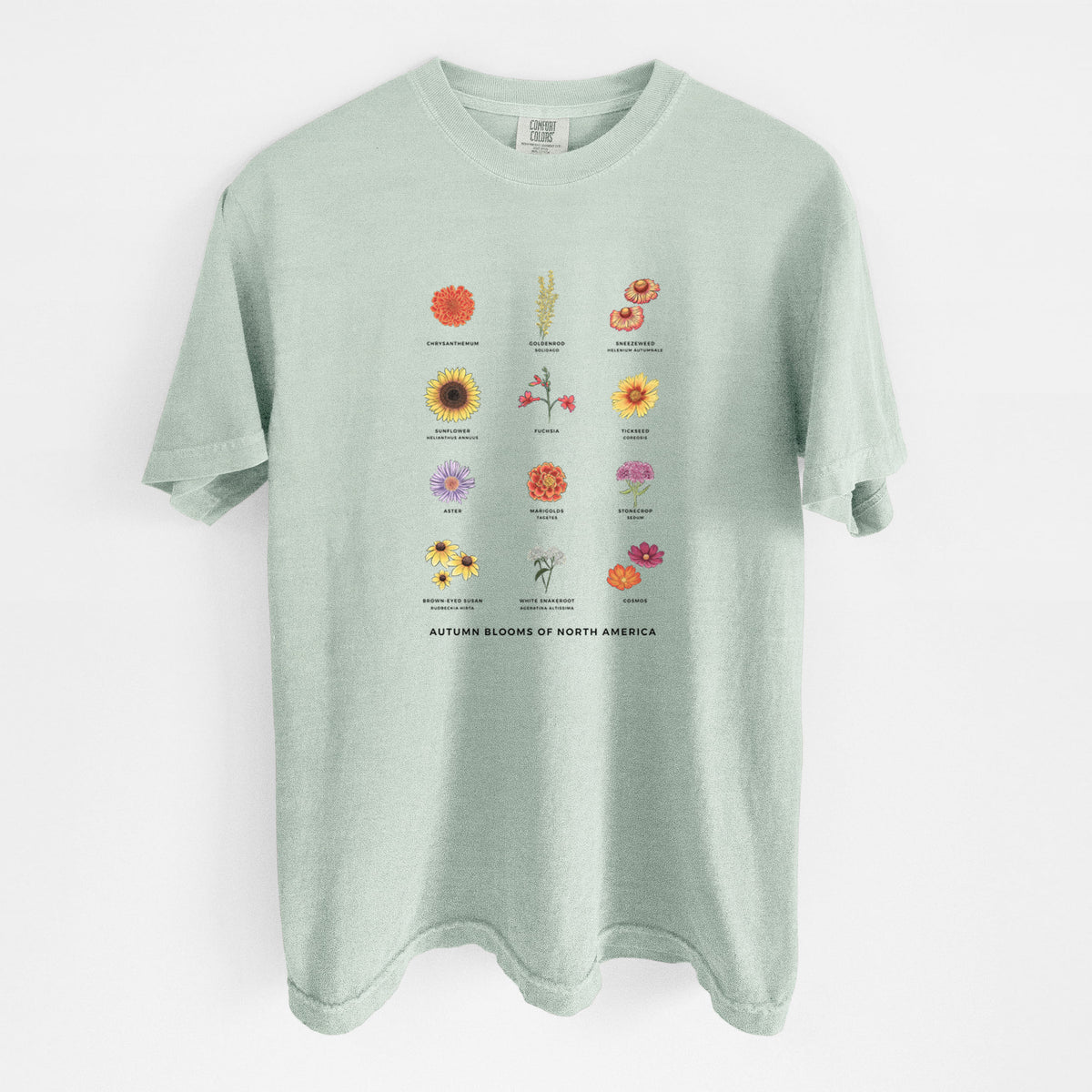 Bay green Comfort Colors t-shirt laid flat, printed with a full-color chart of autumn flowers, each labeled with its name.