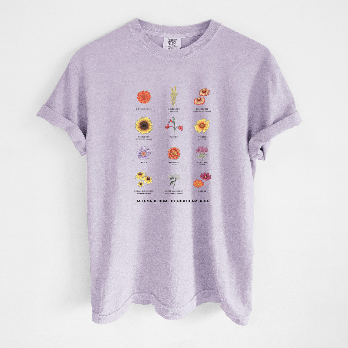 Orchid purple Comfort Colors t-shirt laid flat, printed with a full-color chart of autumn flowers, each labeled with its name.