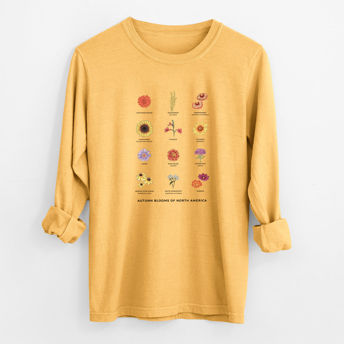 Golden wheat yellow Comfort Colors long sleeve shirt laid flat with the cuffs rolled, printed with a full-color chart of autumn flowers, each labeled with its name.