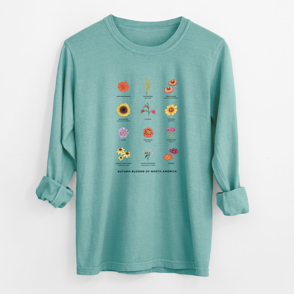 Reef green Comfort Colors long sleeve shirt laid flat with the cuffs rolled, printed with a full-color chart of autumn flowers, each labeled with its name.