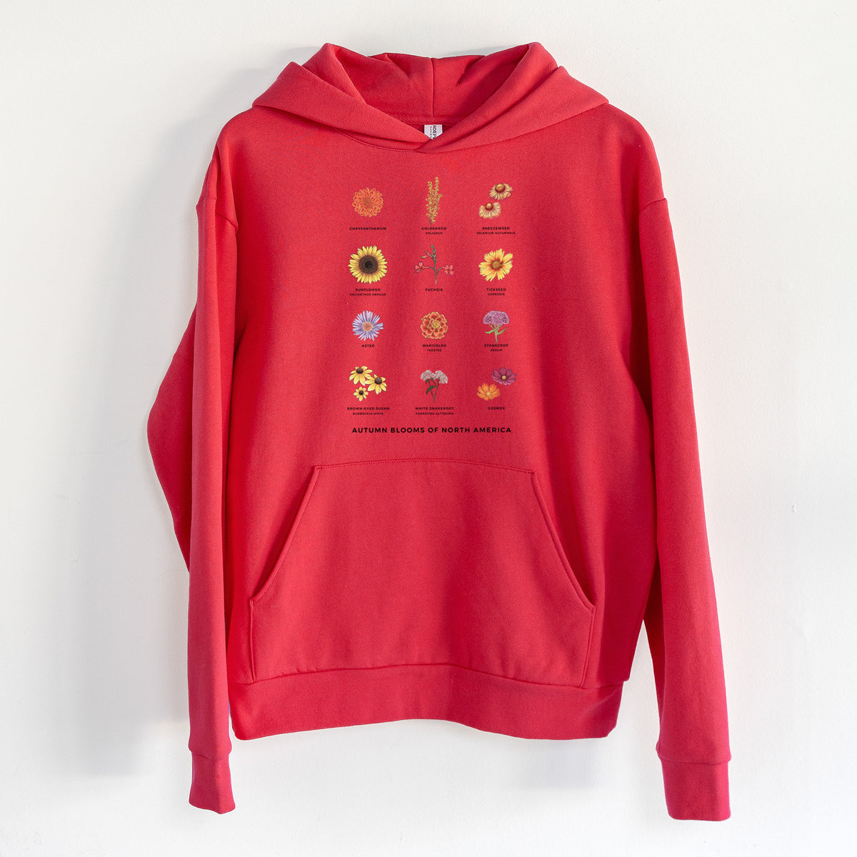 Autumn Blooms of North America - Statement Midweight Hoodie in Cherry Red, hanging on a white wall, with a front kangaroo pocket and no drawcords.