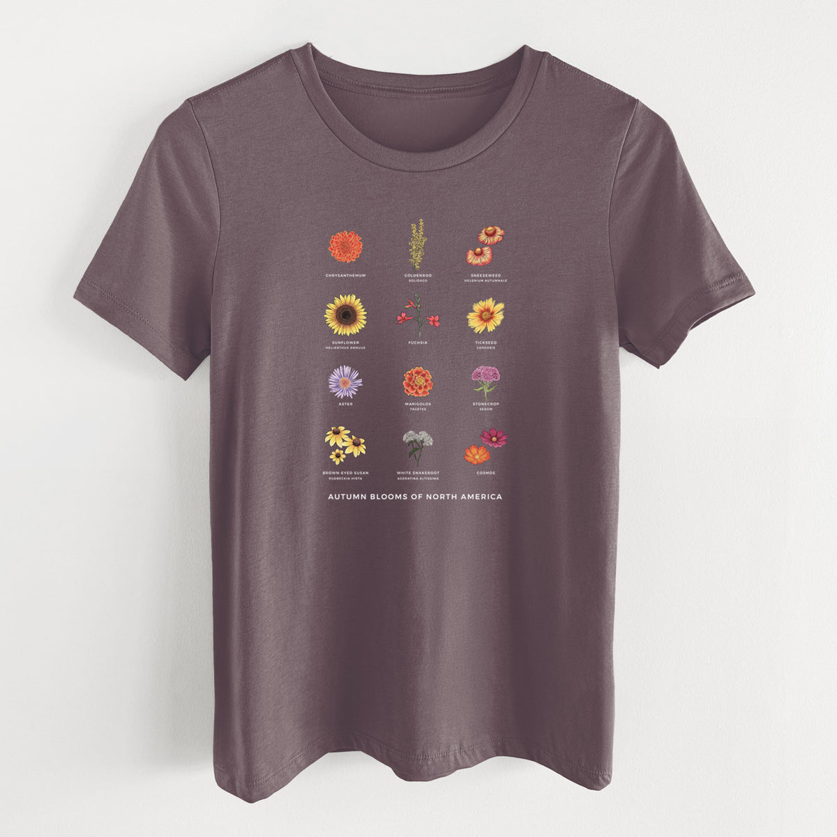 Purple storm women's relaxed fit cotton t-shirt laid flat, printed with a full-color chart of autumn flowers, each labeled with its name.