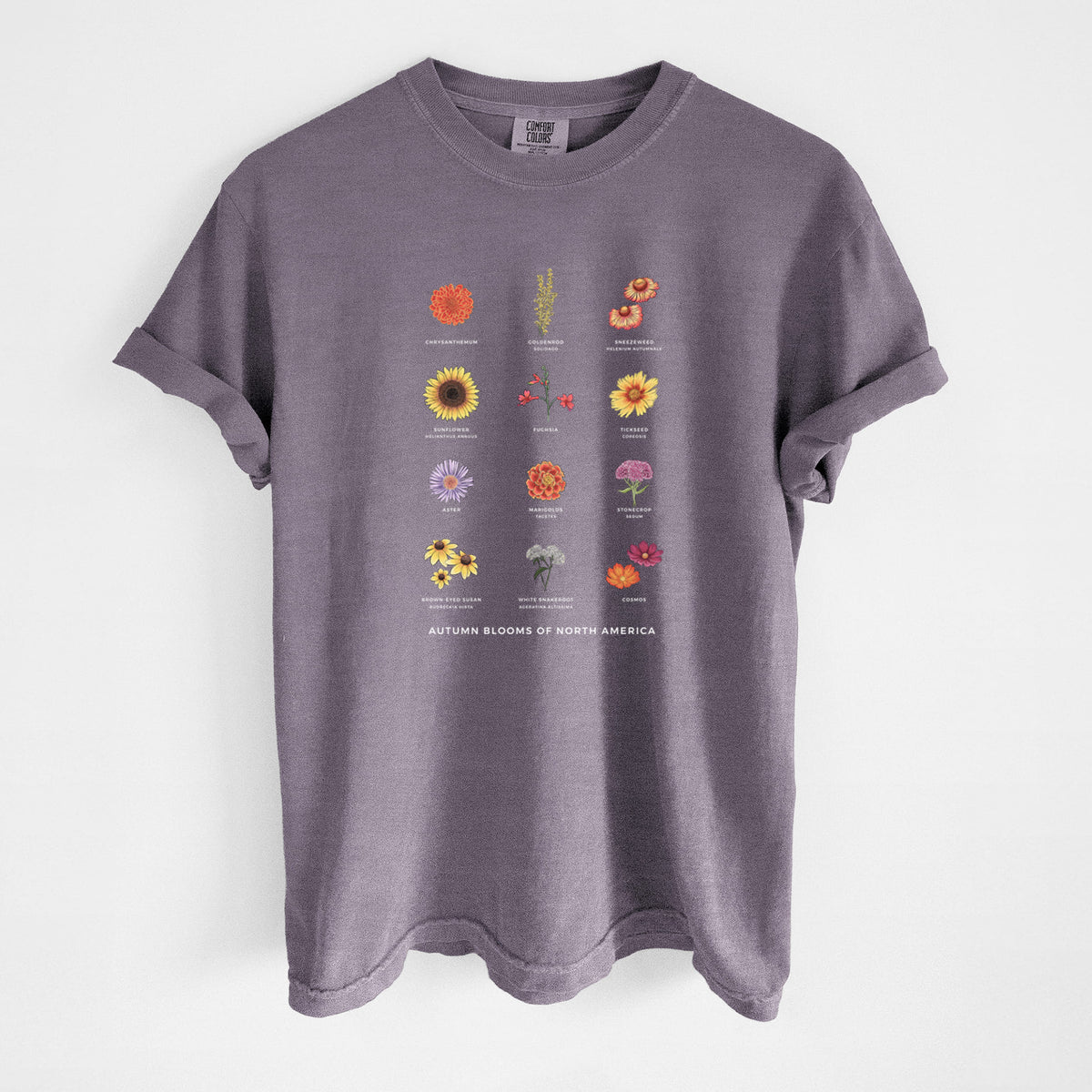 Wine red Comfort Colors t-shirt laid flat, printed with a full-color chart of autumn flowers, each labeled with its name.