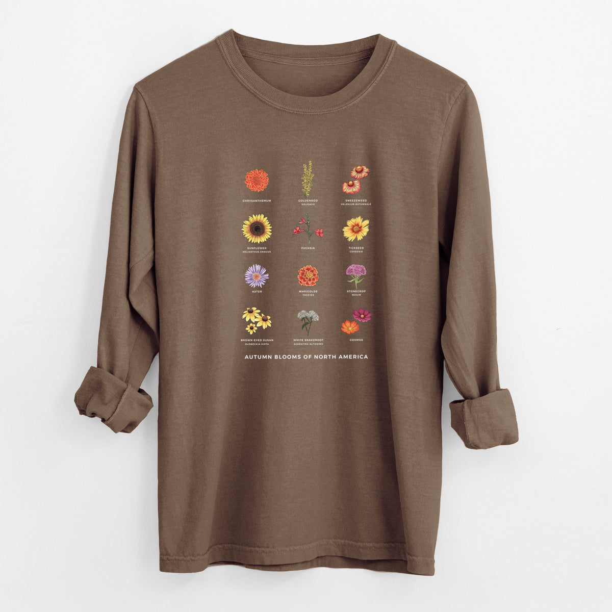 Espresso brown Comfort Colors long sleeve shirt laid flat with the cuffs rolled, printed with a full-color chart of autumn flowers, each labeled with its name.
