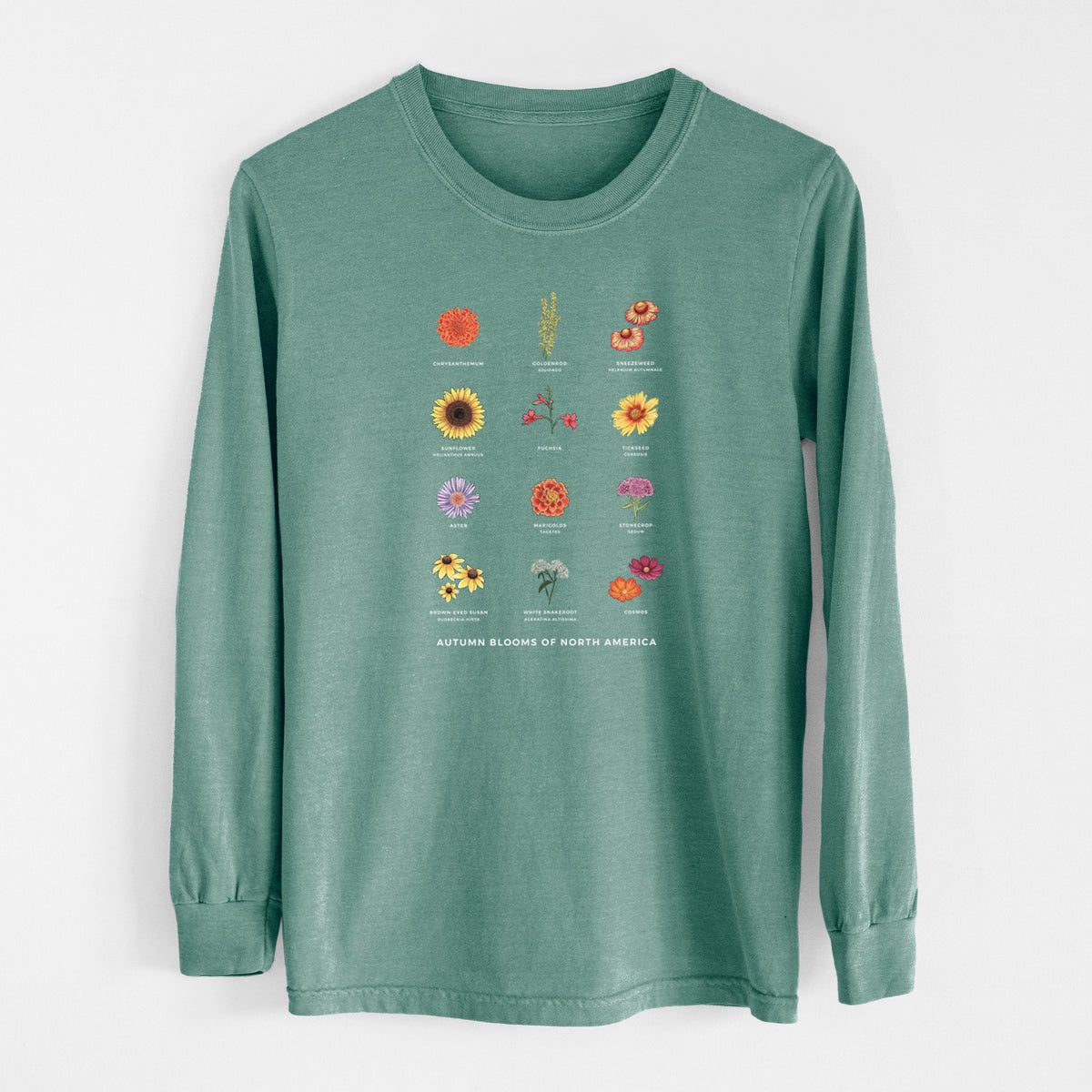 Pine green Comfort Colors long sleeve shirt laid flat, printed with a full-color chart of autumn flowers, each labeled with its name.