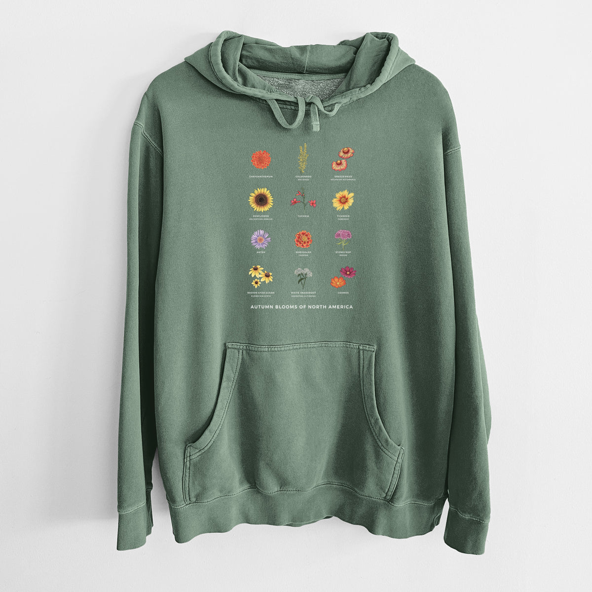 Alpine green pigment dyed hoodie laid flat, printed with a full-color chart of autumn flowers, each labeled with its name.