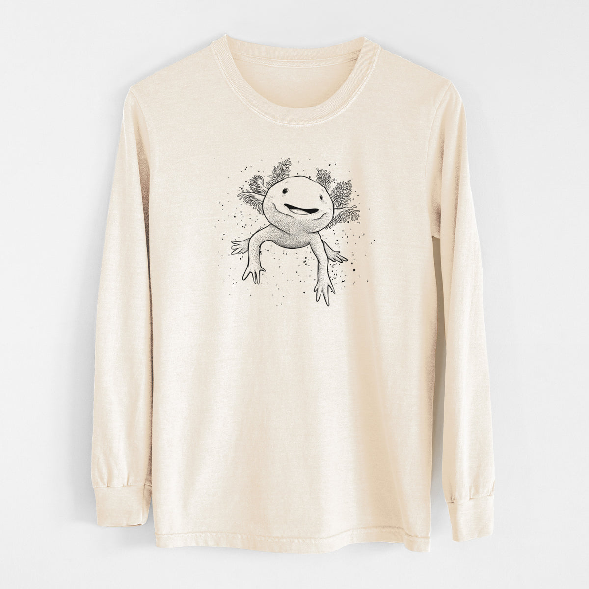 Ivory Comfort Colors long sleeve shirt laid flat, printed with a black ink illustration of a smiling axolotl with feathery gills.
