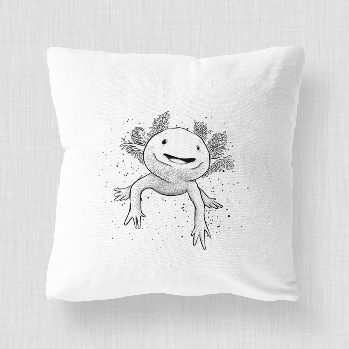 White pillow cover printed with a black ink illustration of a smiling axolotl with feathery gills.