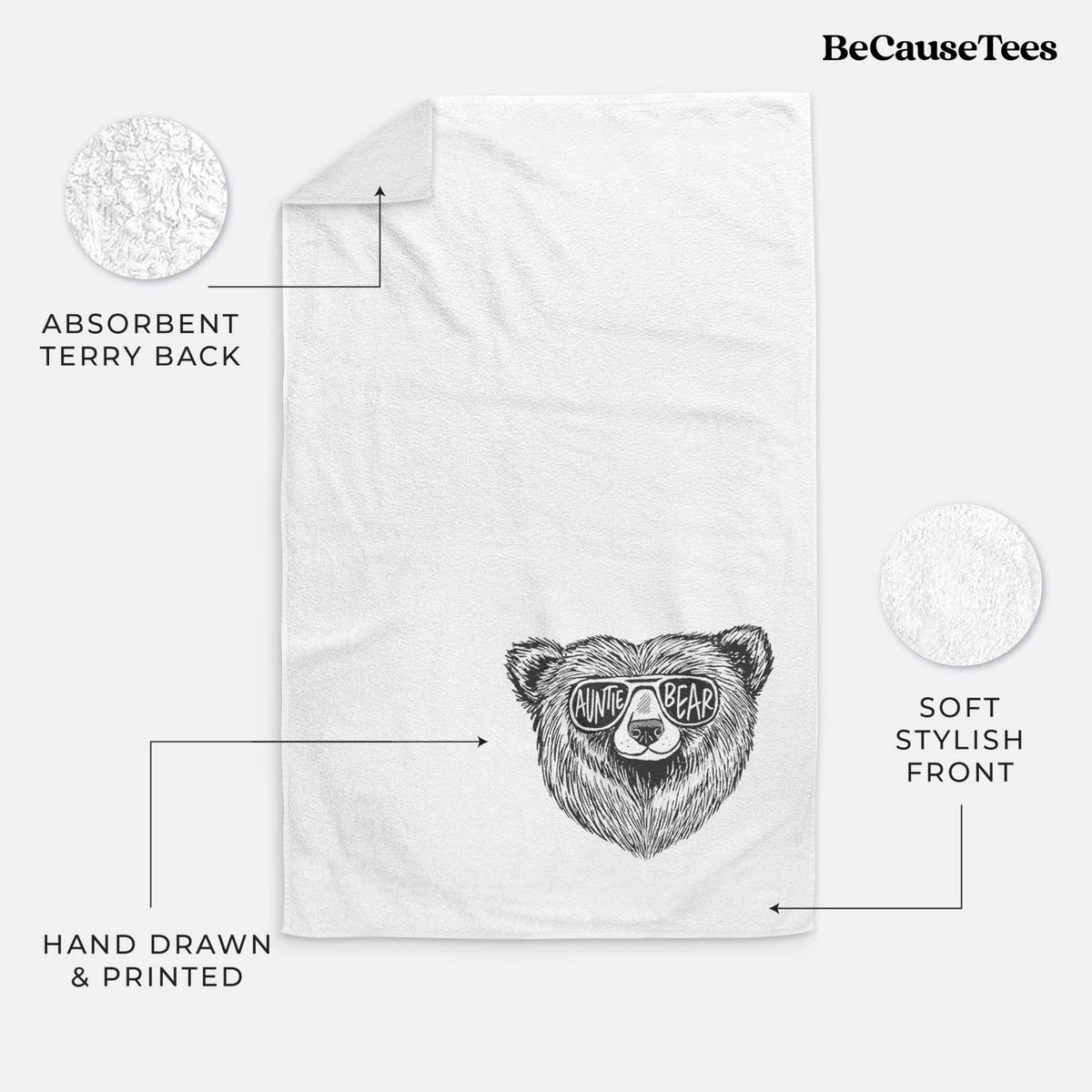 White hand towel printed with a black ink bear's face wearing sunglasses that read Auntie Bear.