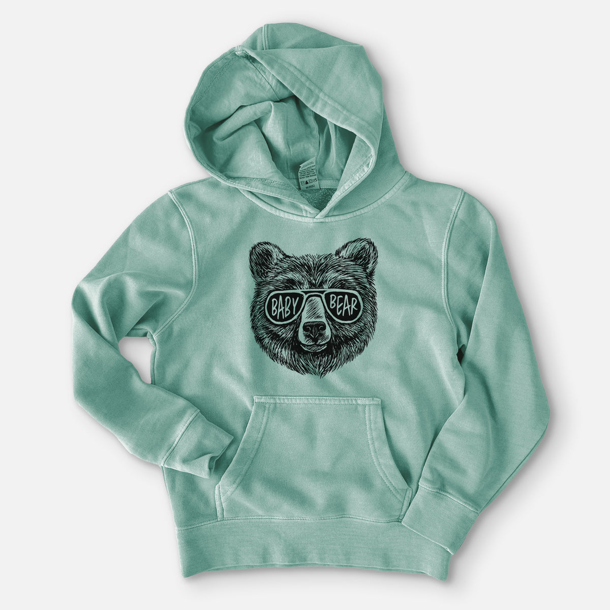 Sea green youth pigment dyed hoodie laid flat, printed with a black ink bear's face wearing sunglasses that read Baby Bear.