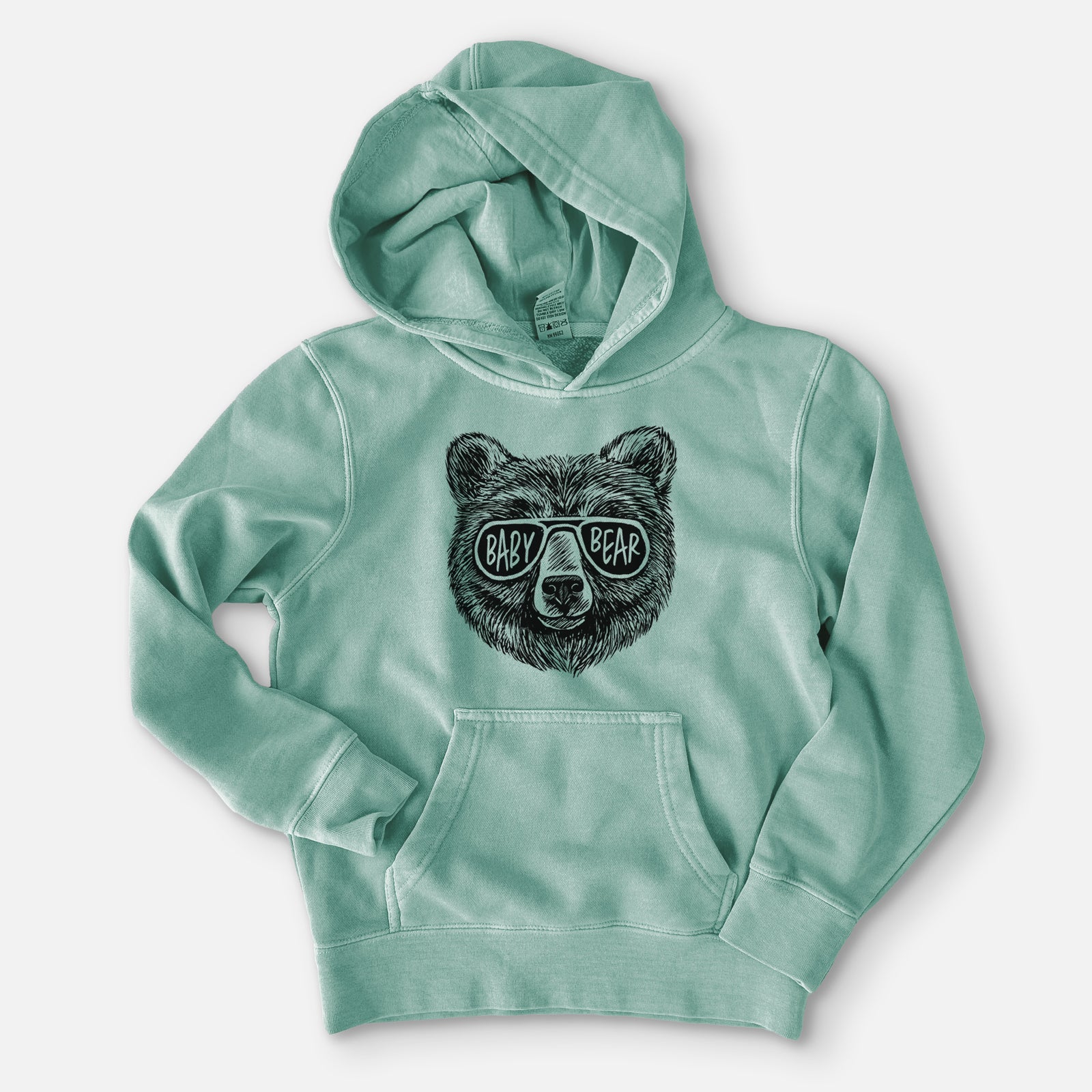 Sea green youth pigment dyed hoodie laid flat, printed with a black ink bear's face wearing sunglasses that read Baby Bear.
