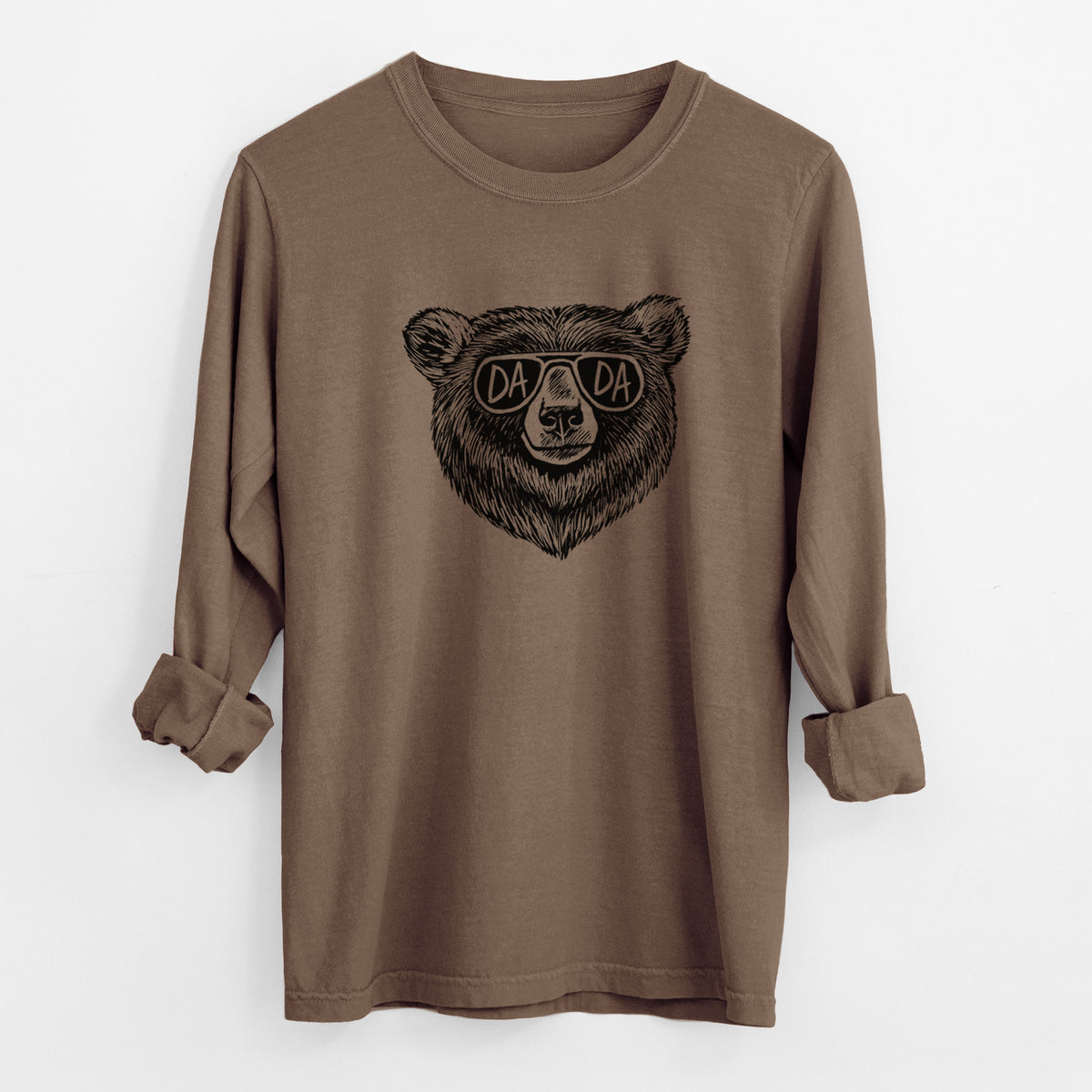 Espresso brown Comfort Colors long sleeve shirt laid flat with the cuffs rolled, printed with a black ink bear's face wearing sunglasses that read Dada.