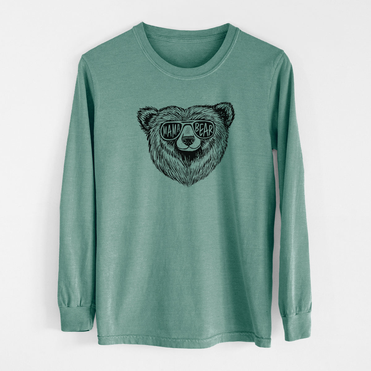 Pine green Comfort Colors long sleeve shirt laid flat, printed with a black ink bear's face wearing sunglasses that read Mama Bear.