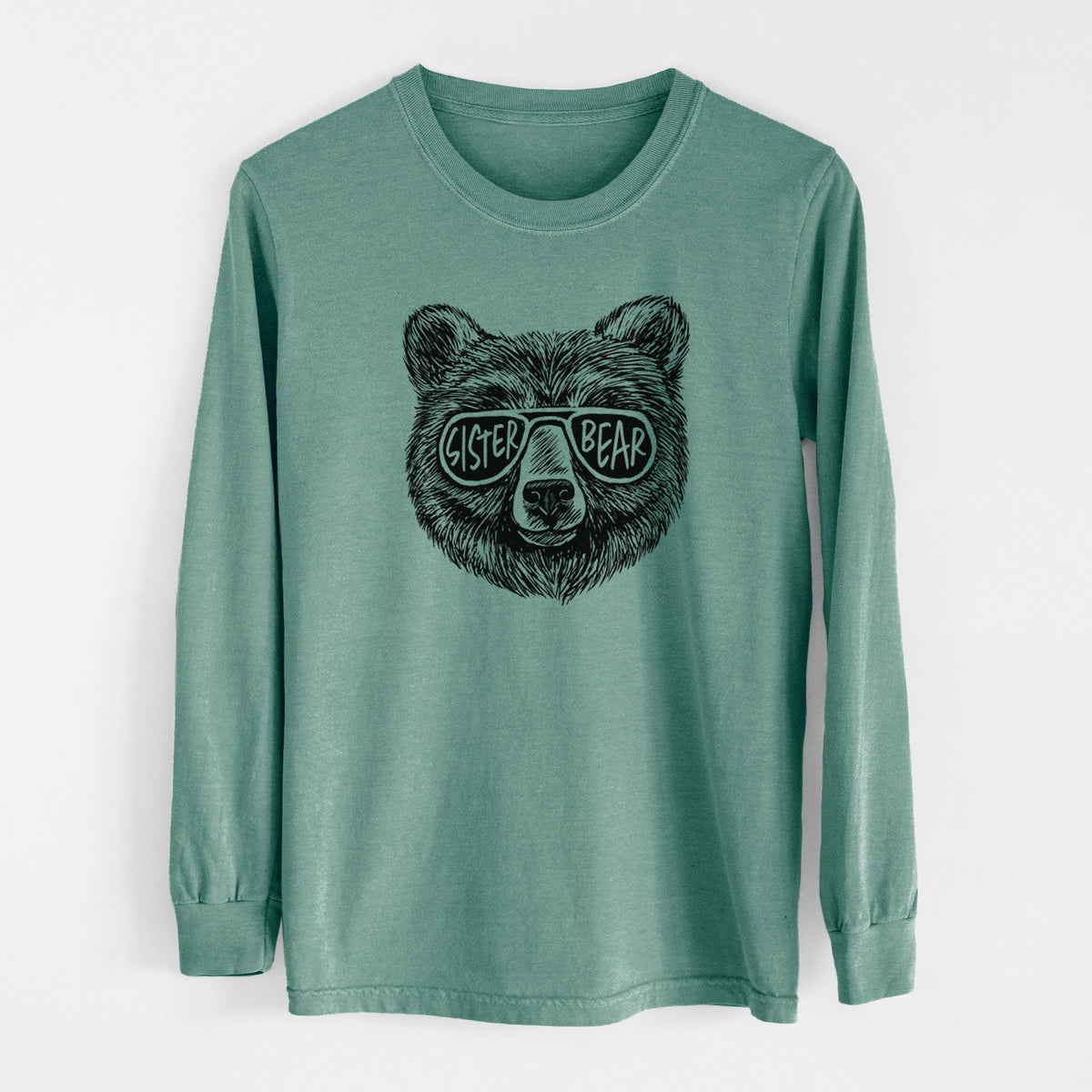 Pine green Comfort Colors long sleeve shirt laid flat, printed with a black ink bear's face wearing sunglasses that read Sister Bear.