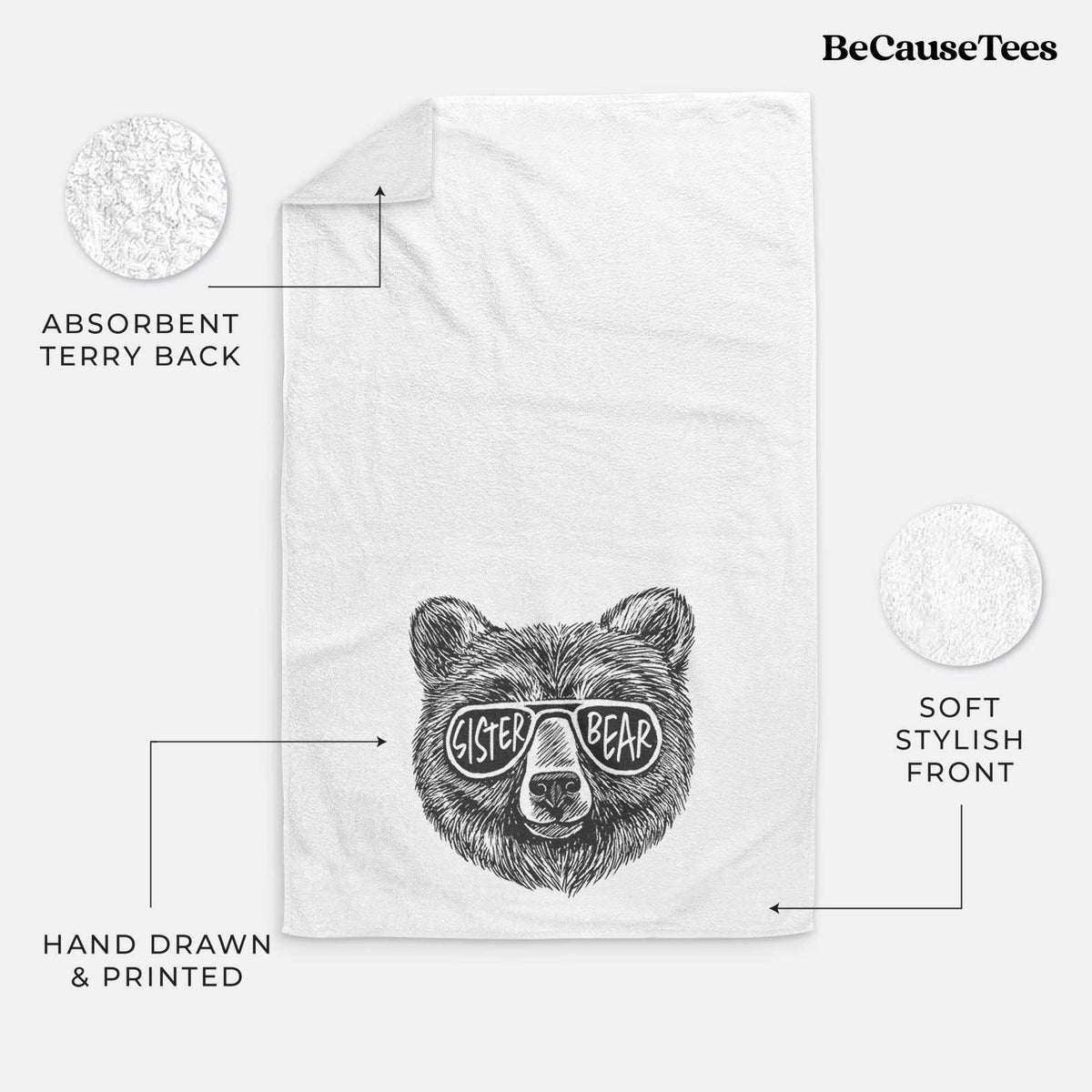 White hand towel printed with a black ink bear's face wearing sunglasses that read Sister Bear.