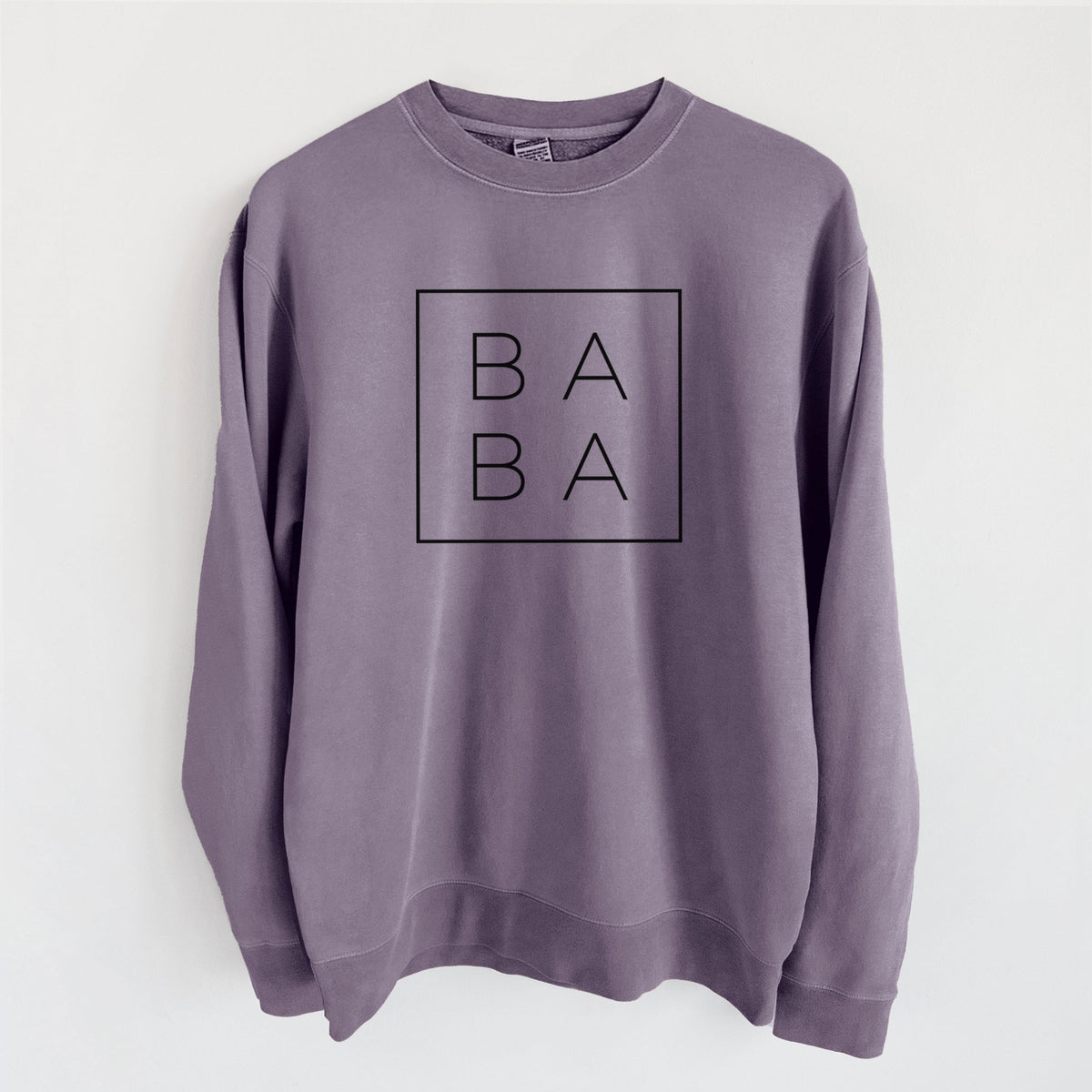 Plum purple pigment dyed crewneck sweatshirt laid flat, printed with the word BABA in thin black letters stacked inside a square outline.
