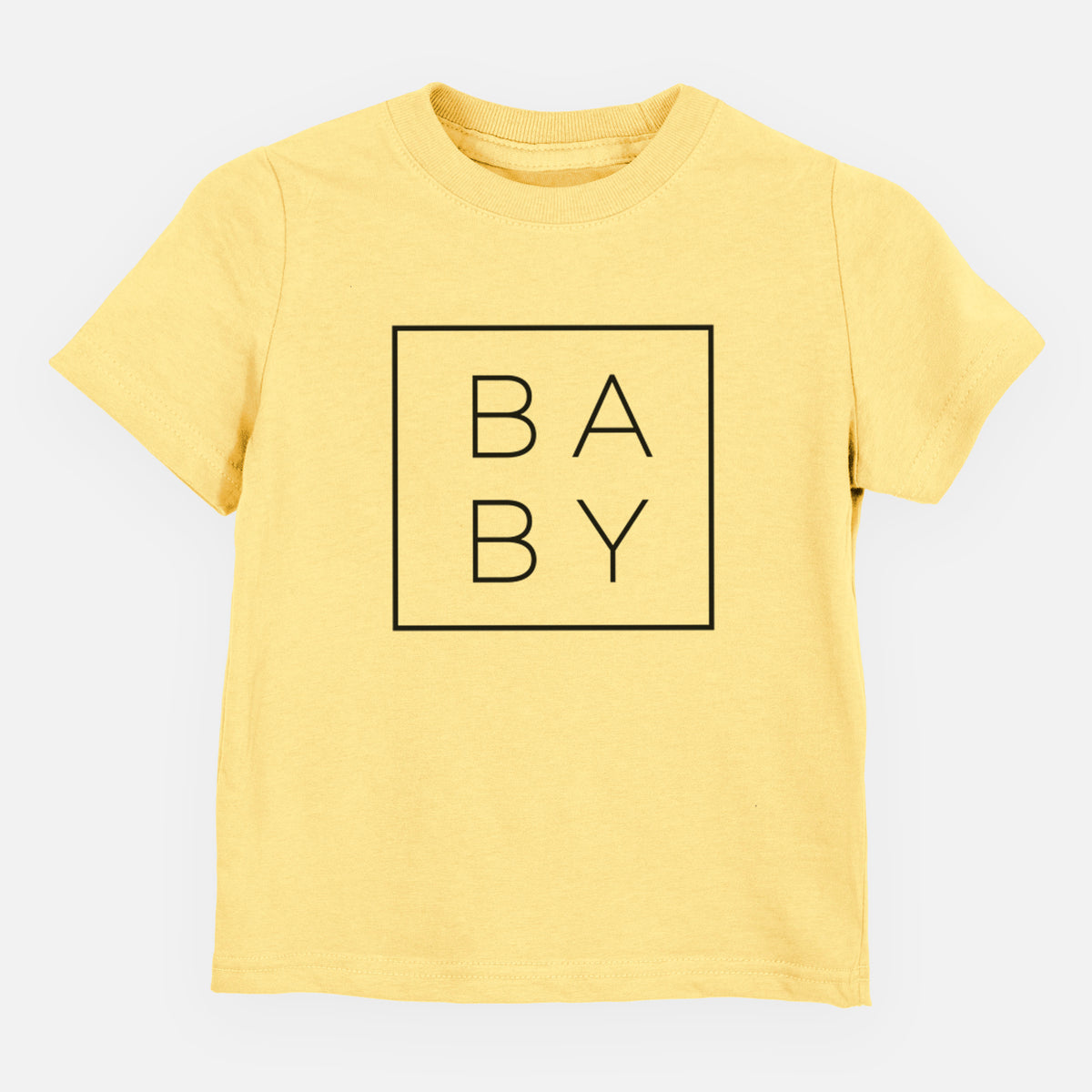 Butter yellow toddler t-shirt laid flat, printed with the word BABY in thin black letters stacked inside a square outline.