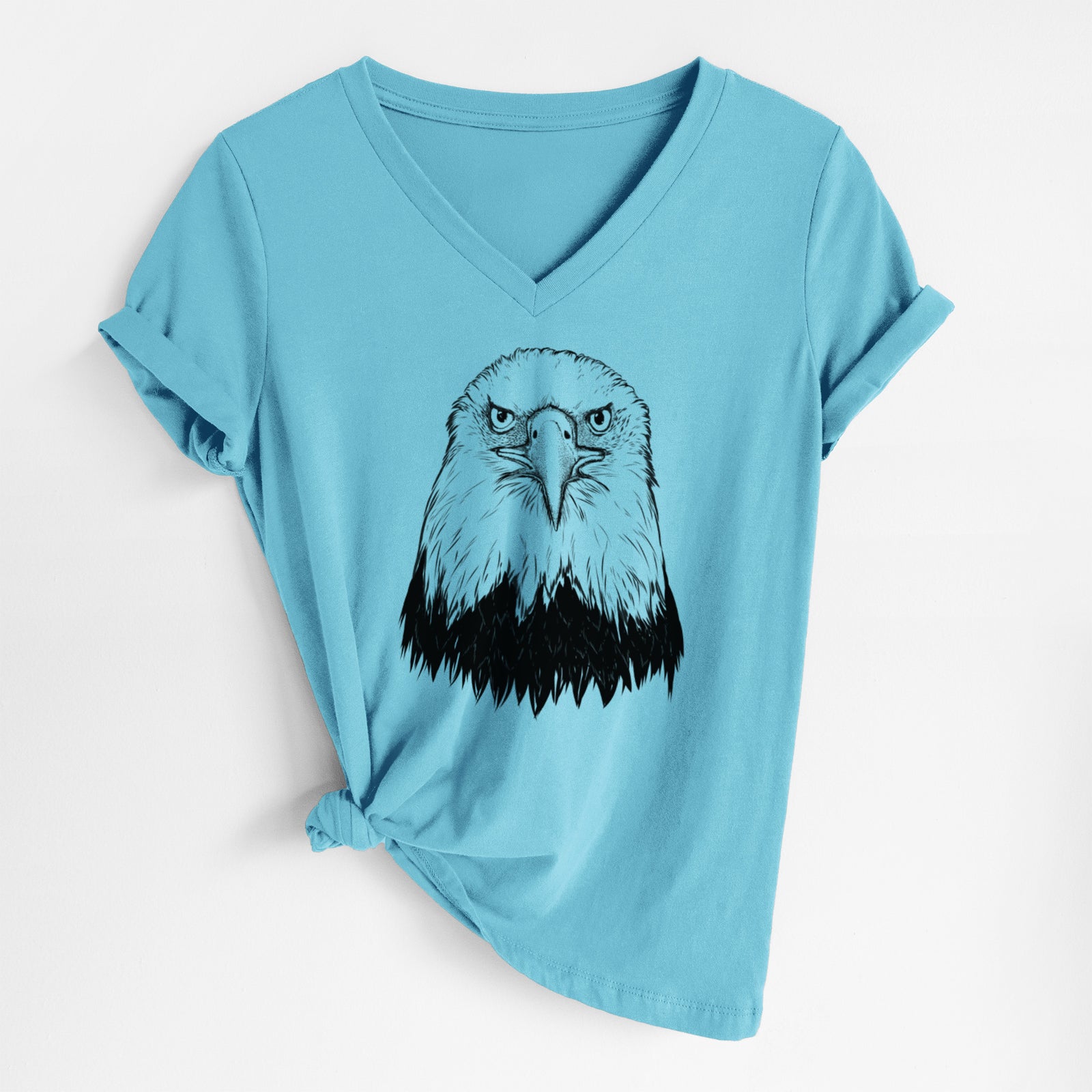 Turquoise women's relaxed fit cotton V-neck t-shirt laid flat, printed with a detailed black ink portrait of a bald eagle facing forward.