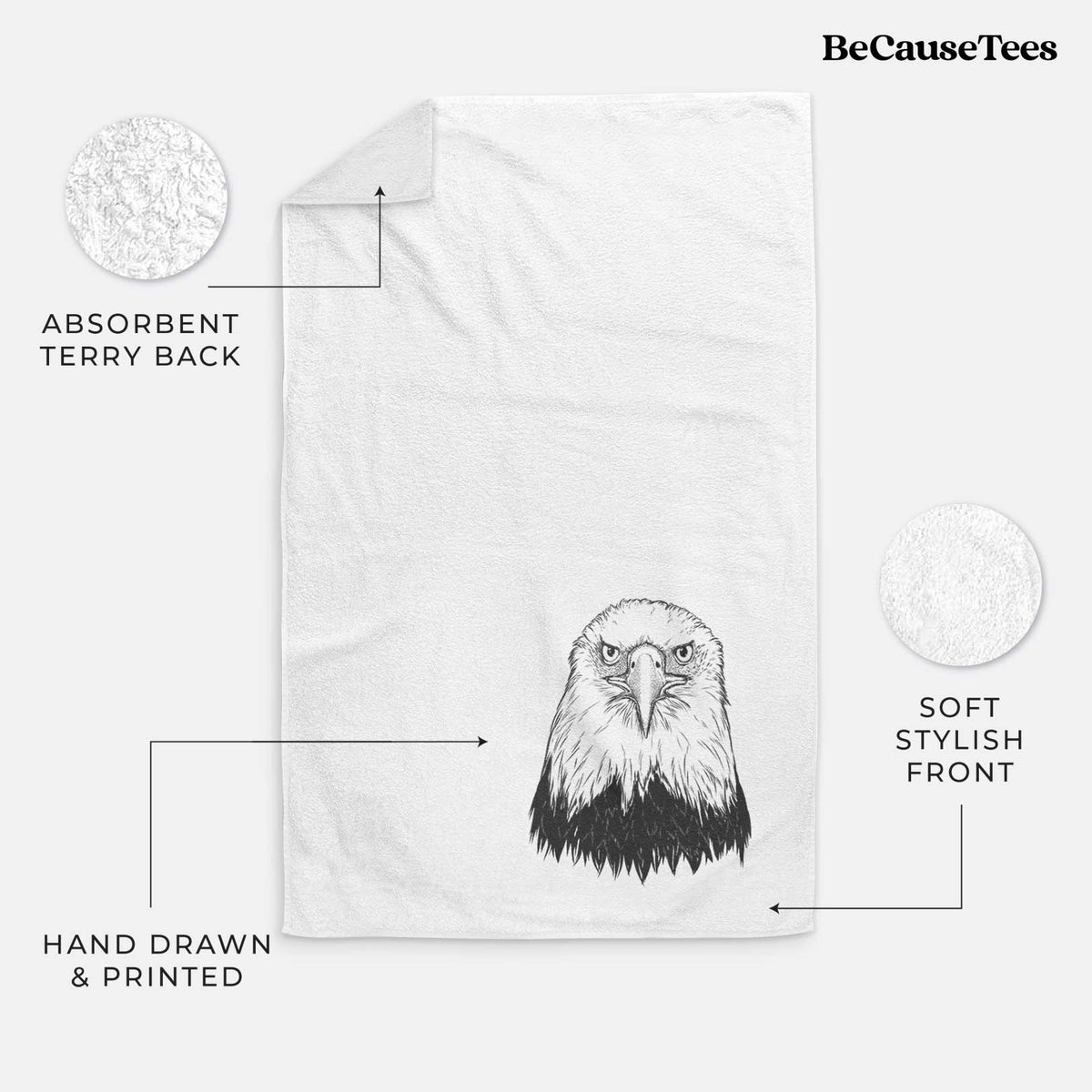 White hand towel printed with a detailed black ink portrait of a bald eagle facing forward.