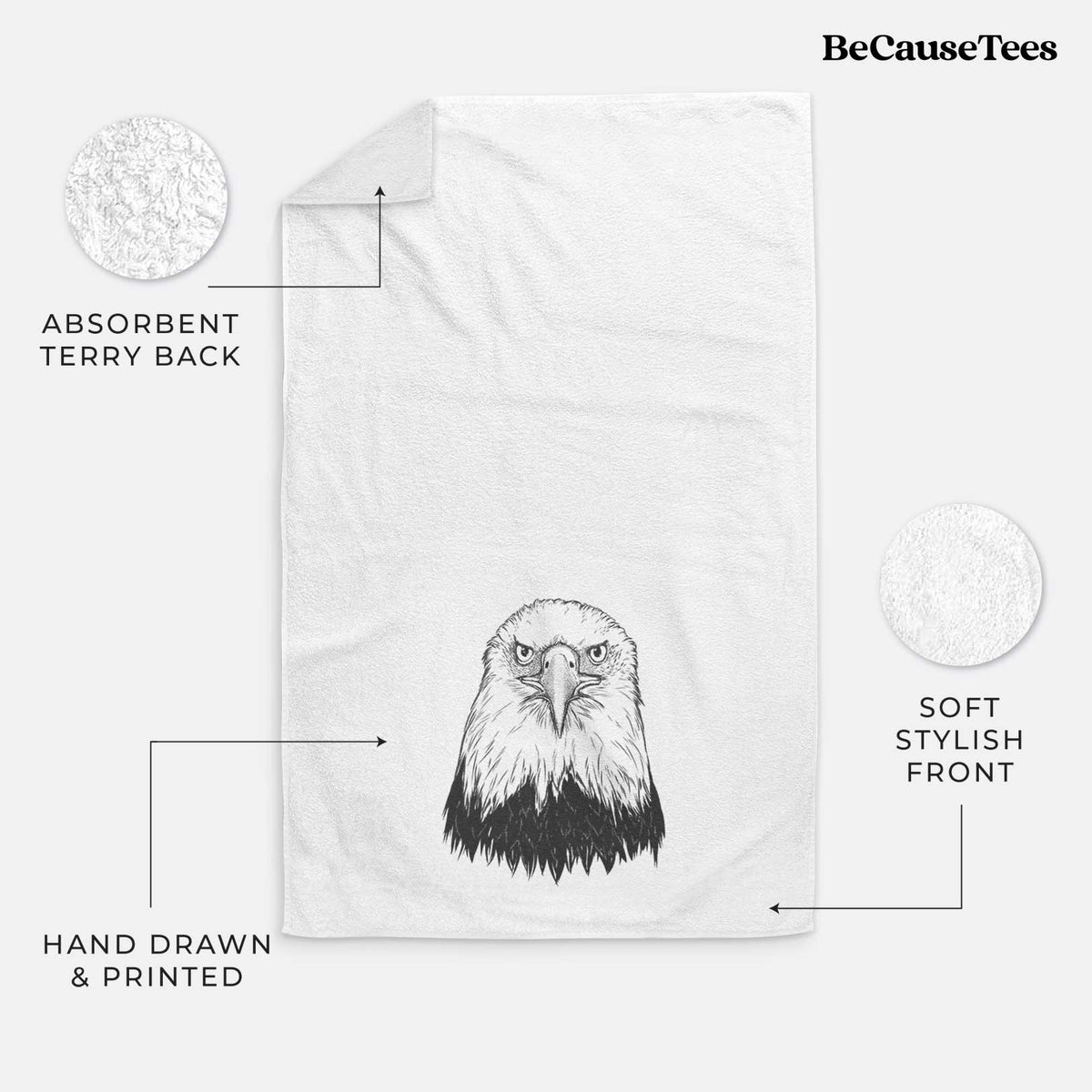 White hand towel printed with a detailed black ink portrait of a bald eagle facing forward.