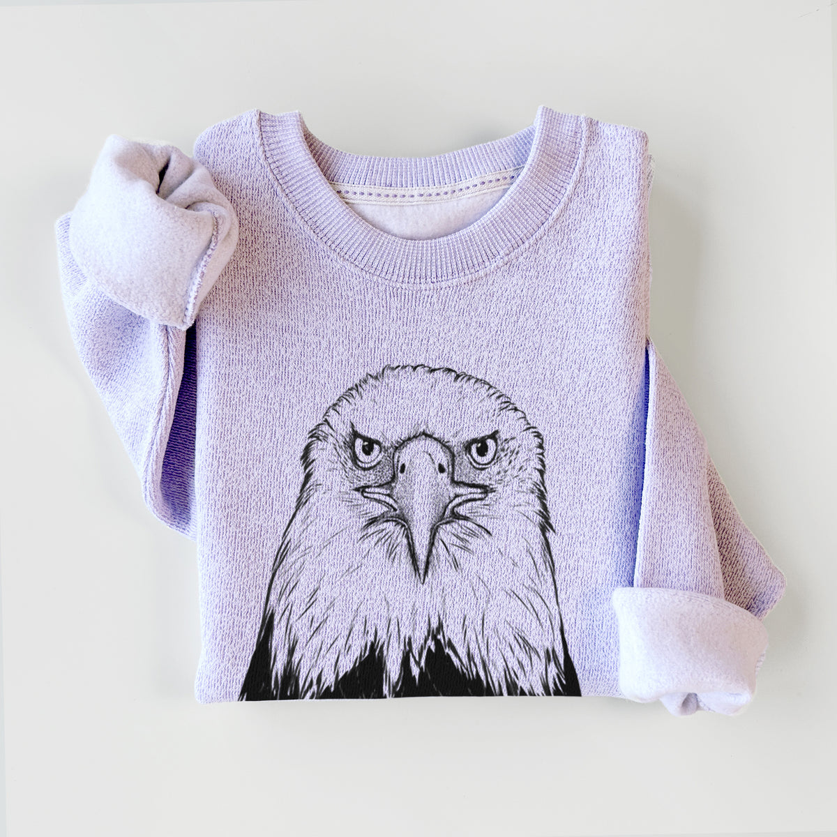 Ice purple knit sweatshirt printed with a detailed black ink portrait of a bald eagle facing forward, styled flat.