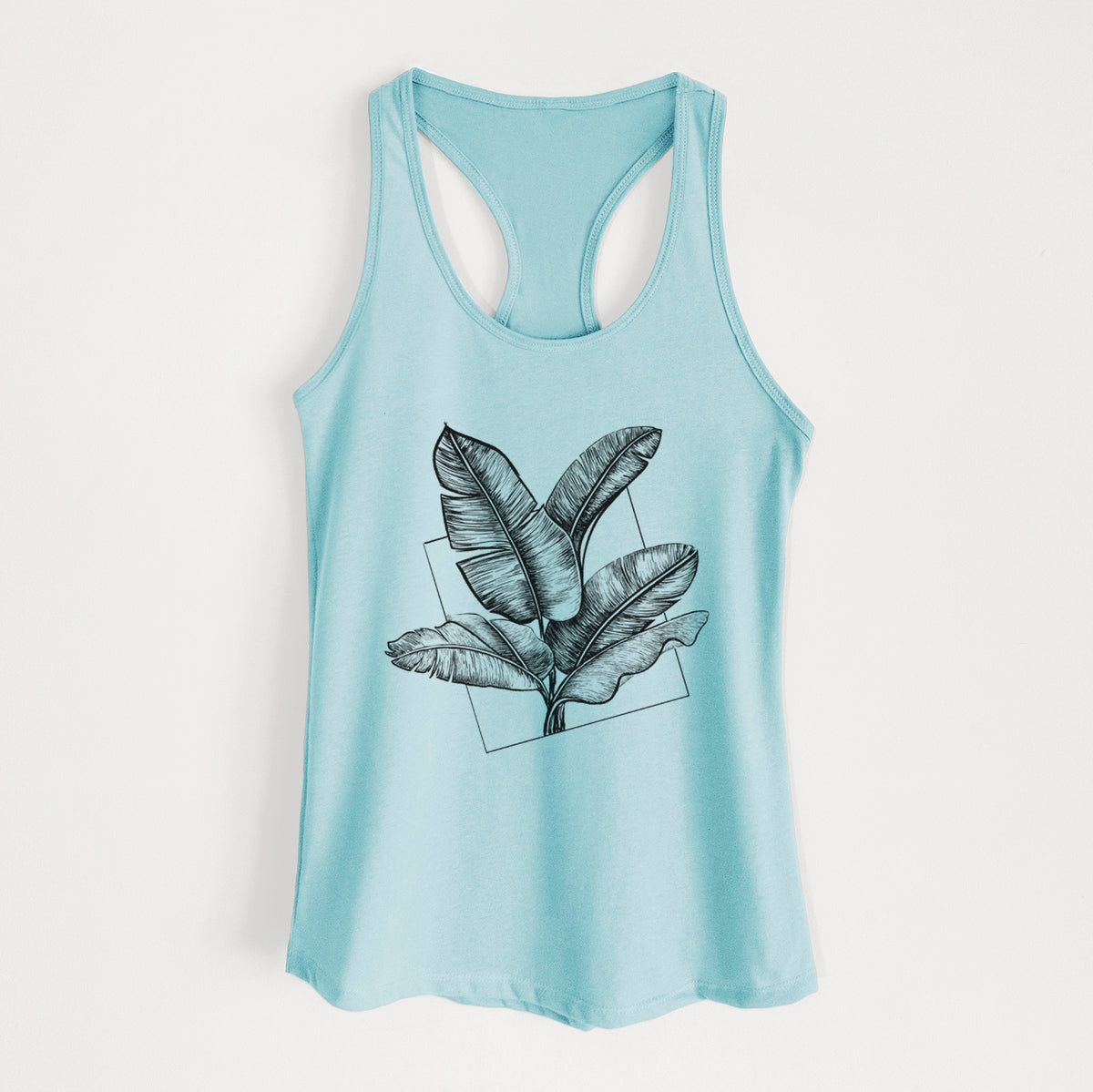 Cancun blue women's racerback tank top laid flat, printed with a black ink illustration of banana leaves in front of a square outline.