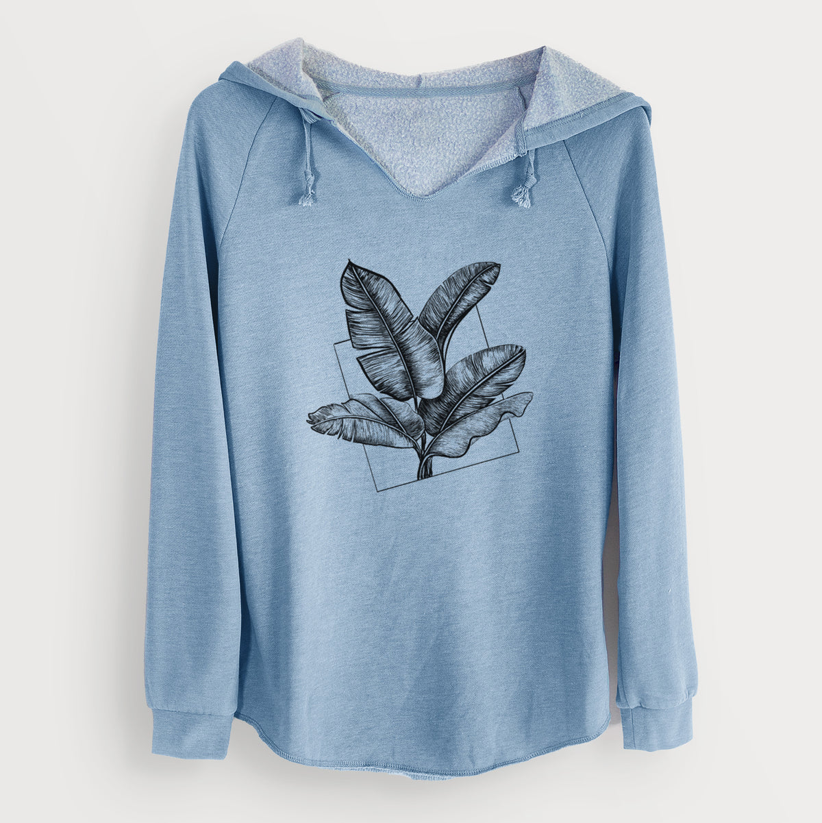 Misty blue women's Cali Wave hooded sweatshirt laid flat, printed with a black ink illustration of banana leaves in front of a square outline.