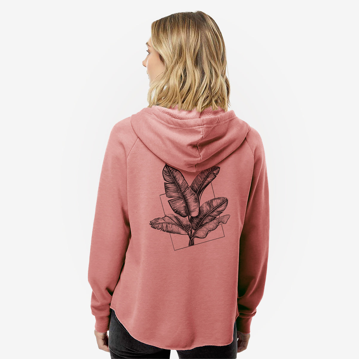 Woman wearing a dusty rose women's Cali Wave zip-up sweatshirt printed with a black ink illustration of banana leaves in front of a square outline, seen from behind.