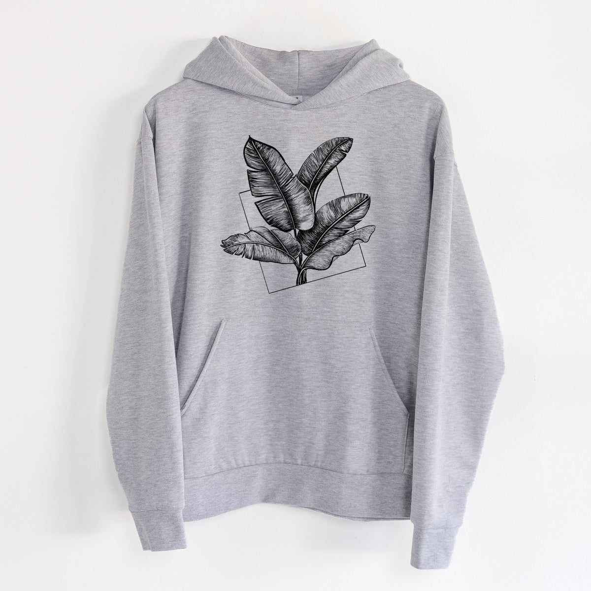 Banana Plant Leaves - Statement Midweight Hoodie in Heather Grey, hanging on a white wall, with a front kangaroo pocket and no drawcords.