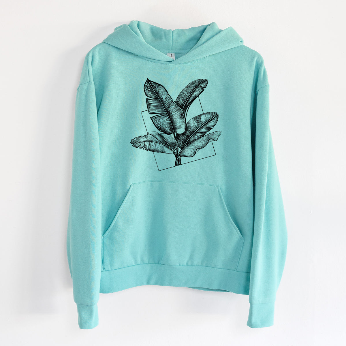 Banana Plant Leaves - Statement Midweight Hoodie in Seafoam, hanging on a white wall, with a front kangaroo pocket and no drawcords.