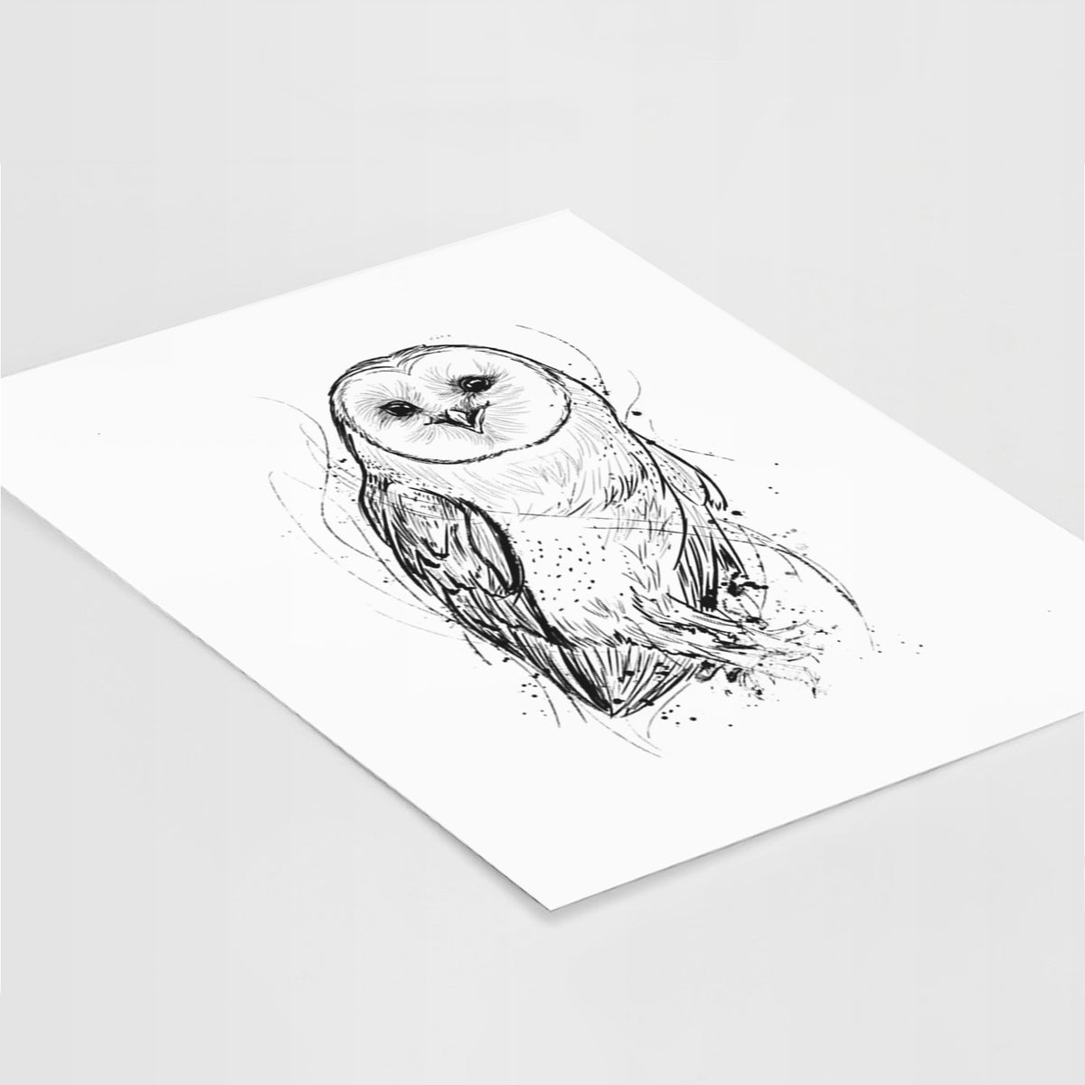 Art print of a detailed black ink illustration of a barn owl standing and facing forward, lying at an angle on a white surface.