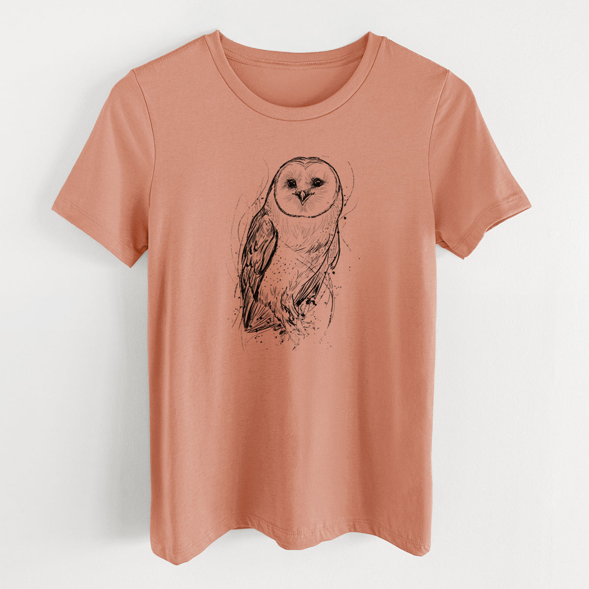 Terracotta orange women's relaxed fit cotton t-shirt laid flat, printed with a detailed black ink illustration of a barn owl standing and facing forward.