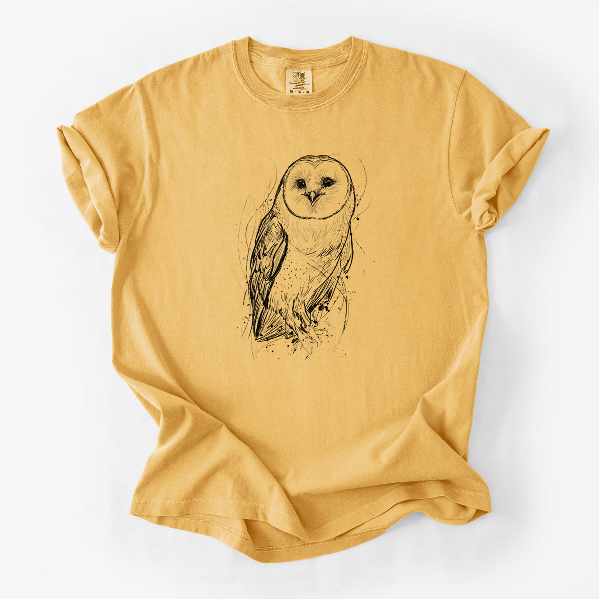 Golden wheat yellow Comfort Colors t-shirt laid flat, printed with a detailed black ink illustration of a barn owl standing and facing forward.