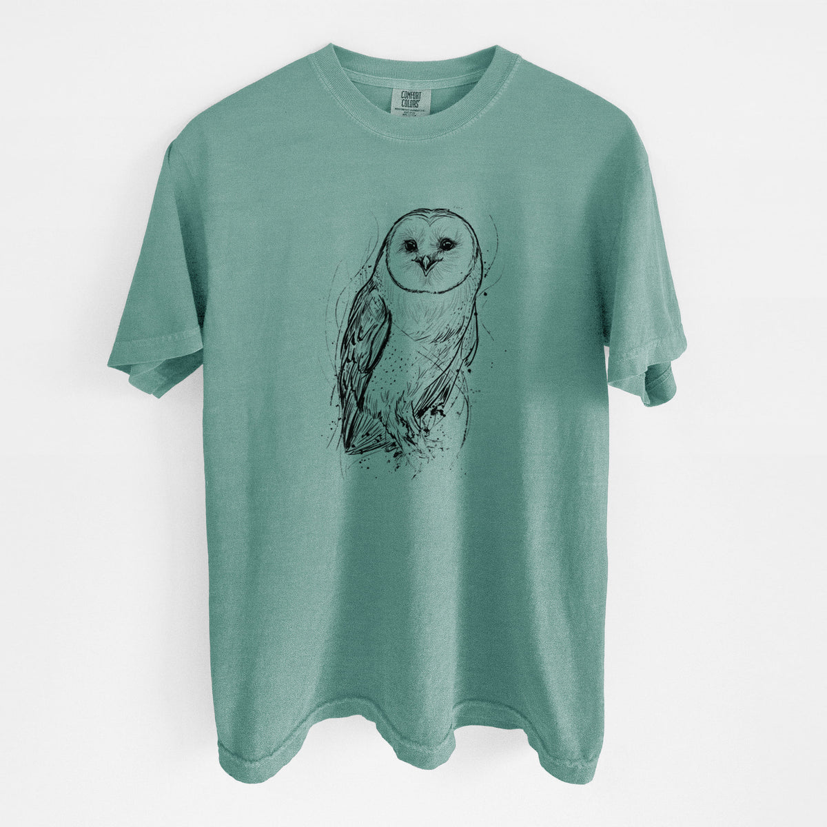 Reef green Comfort Colors t-shirt laid flat, printed with a detailed black ink illustration of a barn owl standing and facing forward.