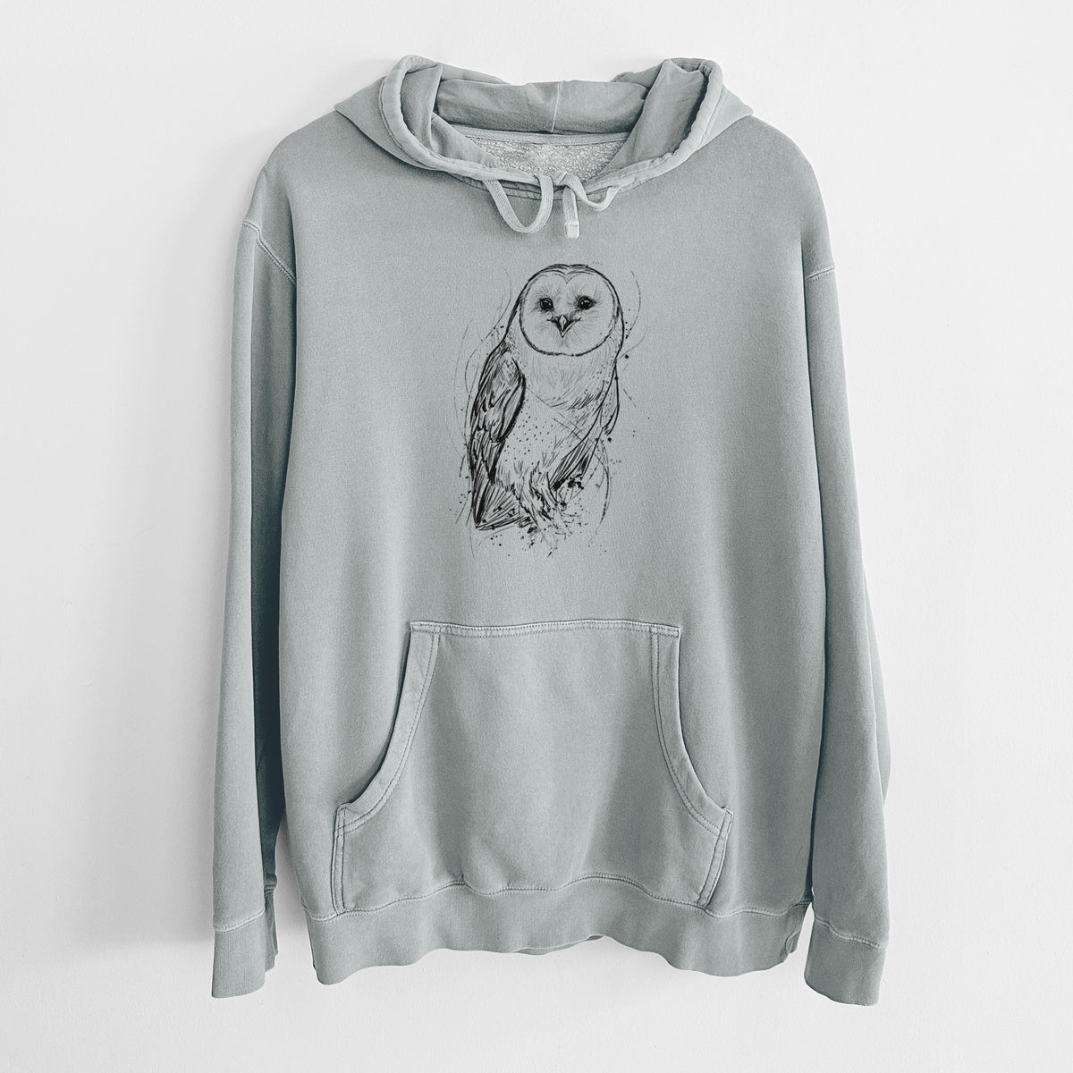 Sage green pigment dyed hoodie laid flat, printed with a detailed black ink illustration of a barn owl standing and facing forward.