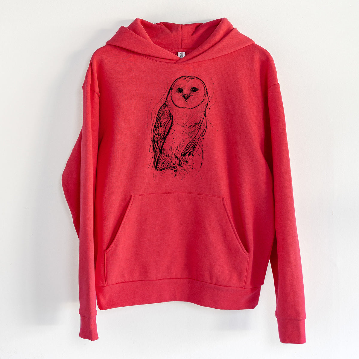 Barn Owl - Tyto alba - Statement Midweight Hoodie in Cherry Red, hanging on a white wall, with a front kangaroo pocket and no drawcords.