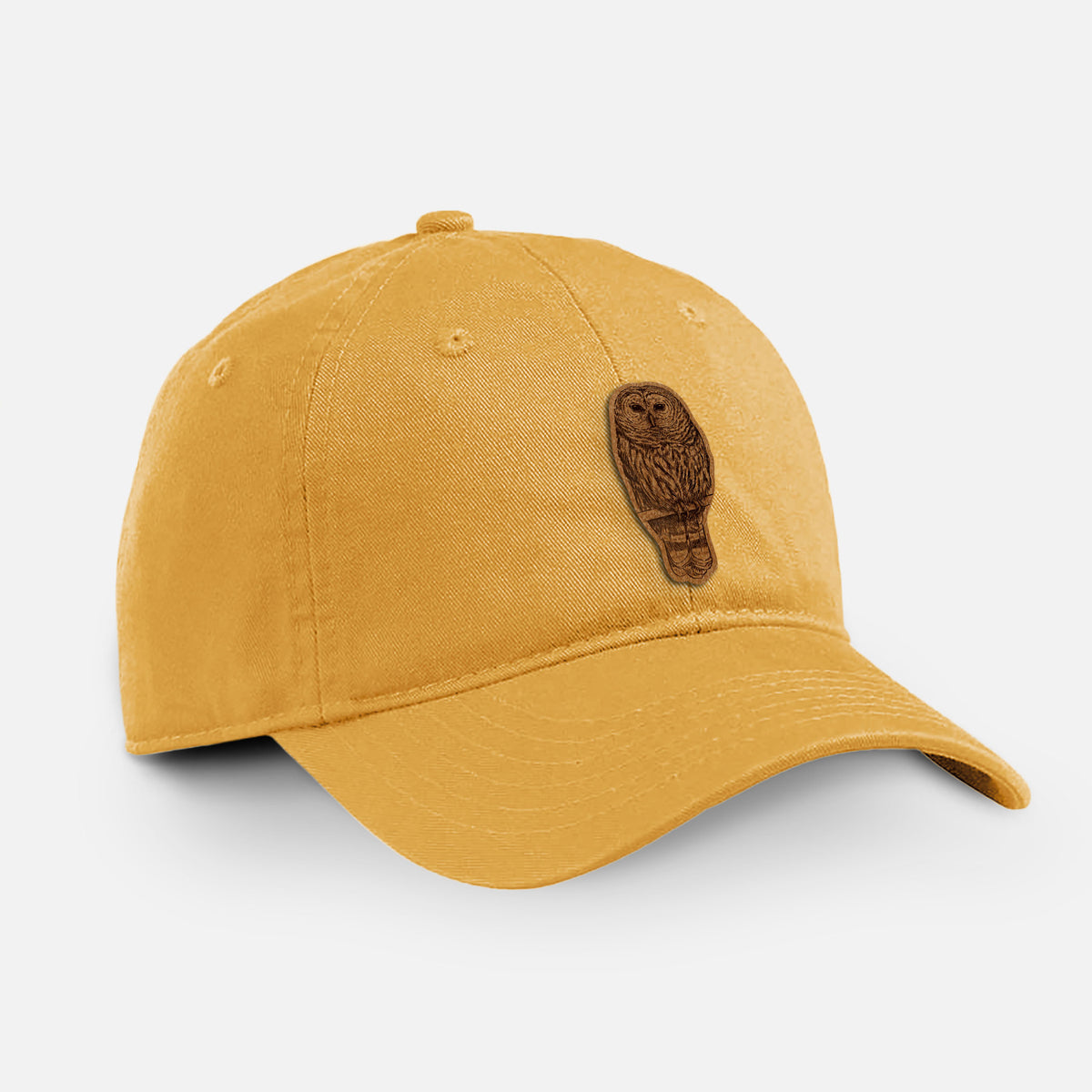 Beehive yellow cotton baseball hat with a detailed black ink illustration of a barred owl perched on a branch on the front.