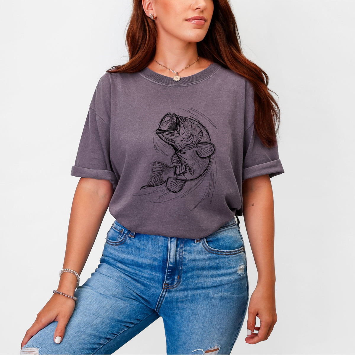 Woman wearing a Comfort Colors t-shirt printed with a detailed black ink illustration of a largemouth bass leaping with its mouth open.