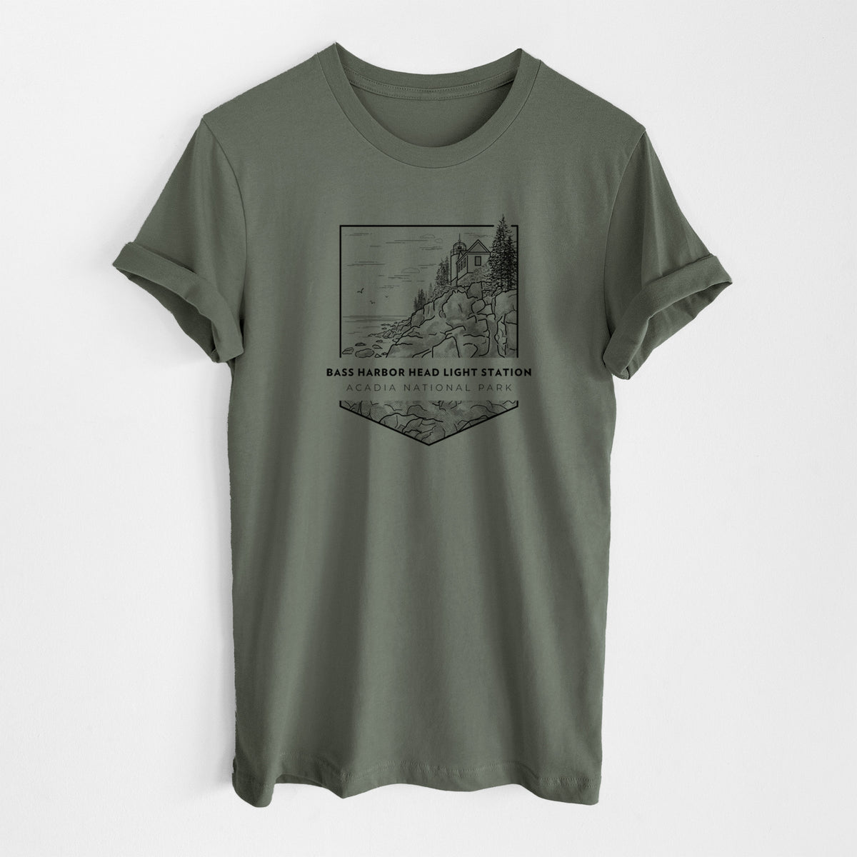 Military green lightweight cotton t-shirt laid flat, printed with a black line art badge of Bass Harbor Head Light Station on a rocky cliff, with the words Acadia National Park.
