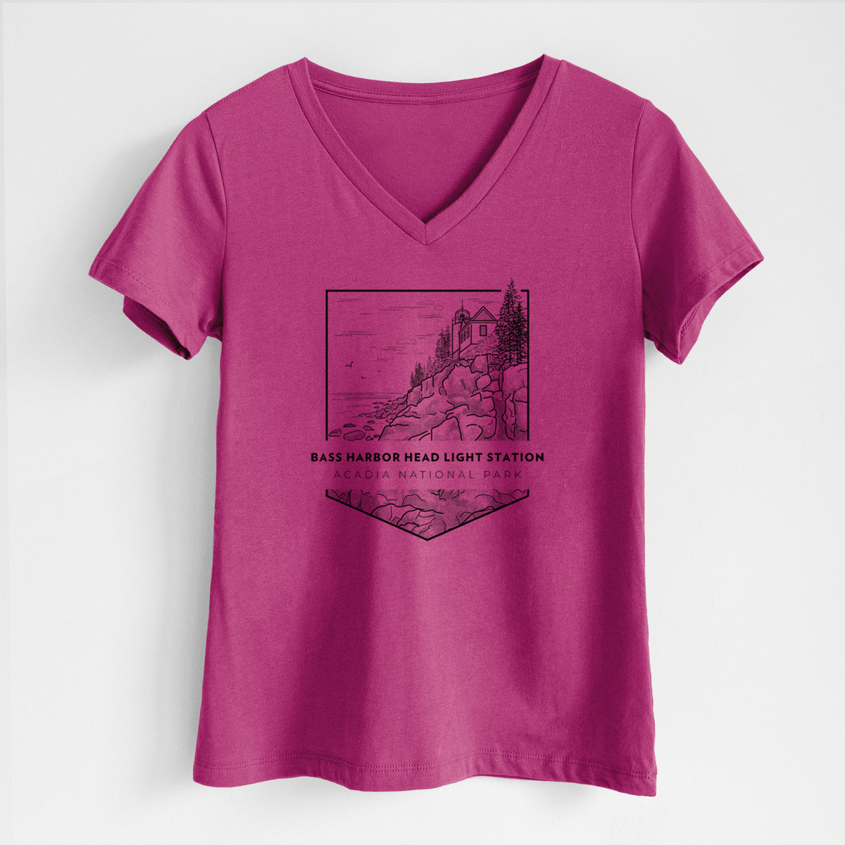 Berry pink women's relaxed fit cotton V-neck t-shirt laid flat, printed with a black line art badge of Bass Harbor Head Light Station on a rocky cliff, with the words Acadia National Park.