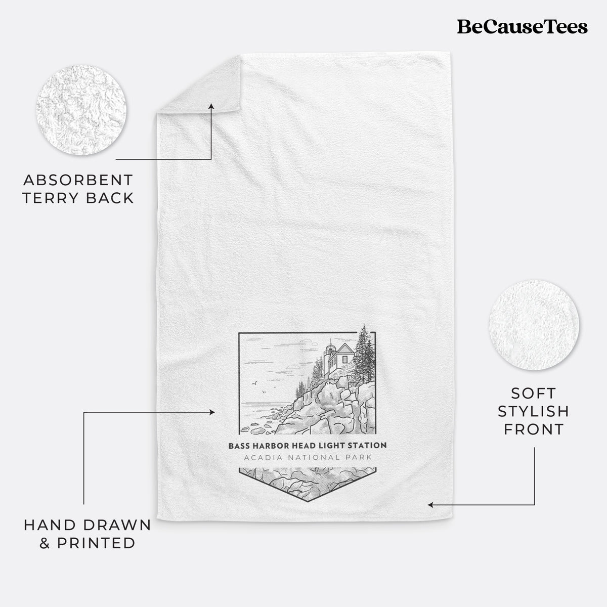 White hand towel printed with a black line art badge of Bass Harbor Head Light Station on a rocky cliff, with the words Acadia National Park.