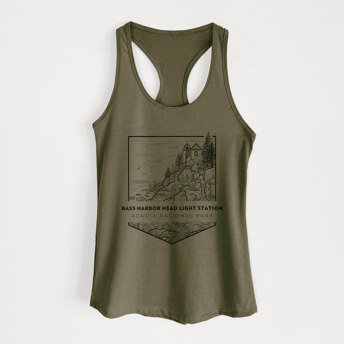 Military green women's racerback tank top laid flat, printed with a black line art badge of Bass Harbor Head Light Station on a rocky cliff, with the words Acadia National Park.