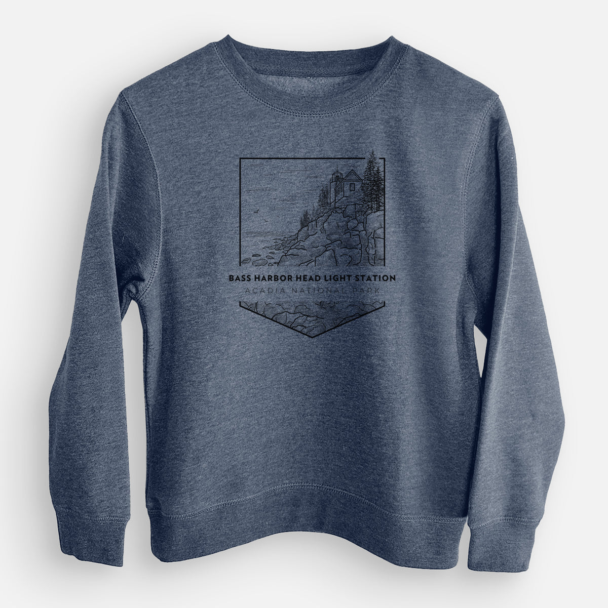 Storm blue youth crewneck sweatshirt laid flat, printed with a black line art badge of Bass Harbor Head Light Station on a rocky cliff, with the words Acadia National Park.