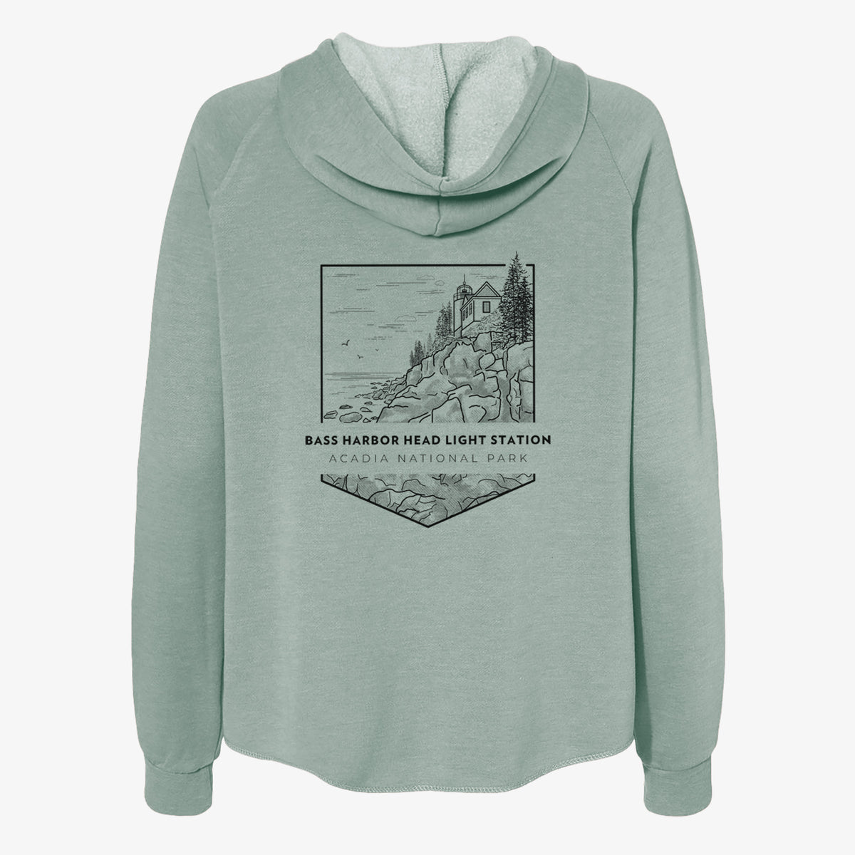 Sage green women's Cali Wave zip-up sweatshirt laid flat, printed with a black line art badge of Bass Harbor Head Light Station on a rocky cliff, with the words Acadia National Park.