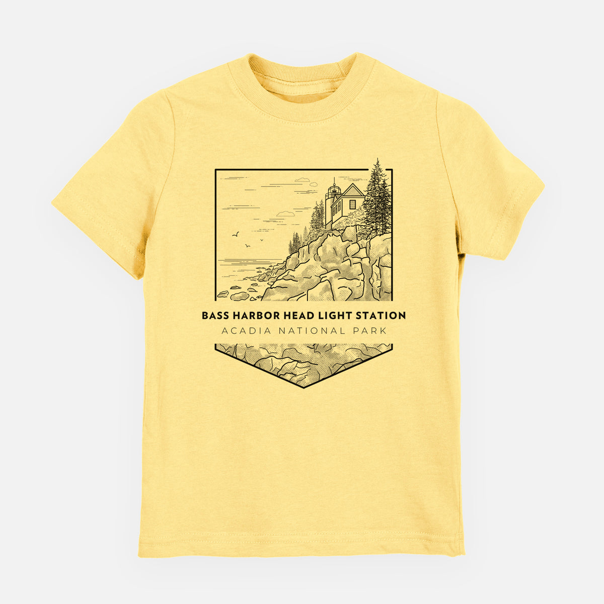Butter yellow youth t-shirt laid flat, printed with a black line art badge of Bass Harbor Head Light Station on a rocky cliff, with the words Acadia National Park.
