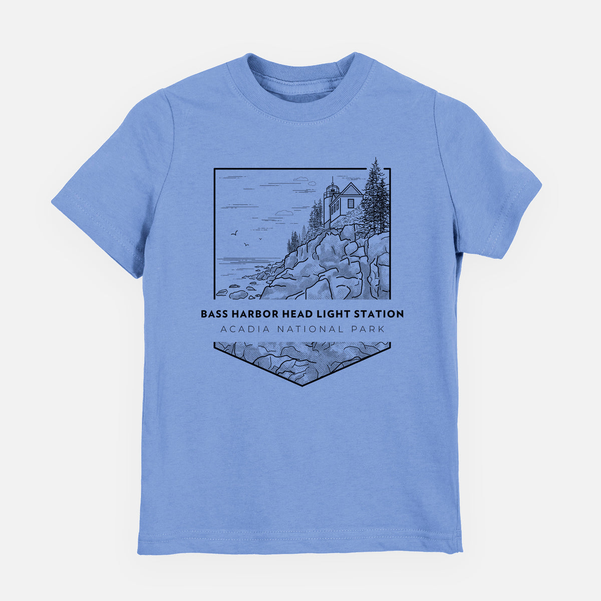 Carolina blue youth t-shirt laid flat, printed with a black line art badge of Bass Harbor Head Light Station on a rocky cliff, with the words Acadia National Park.
