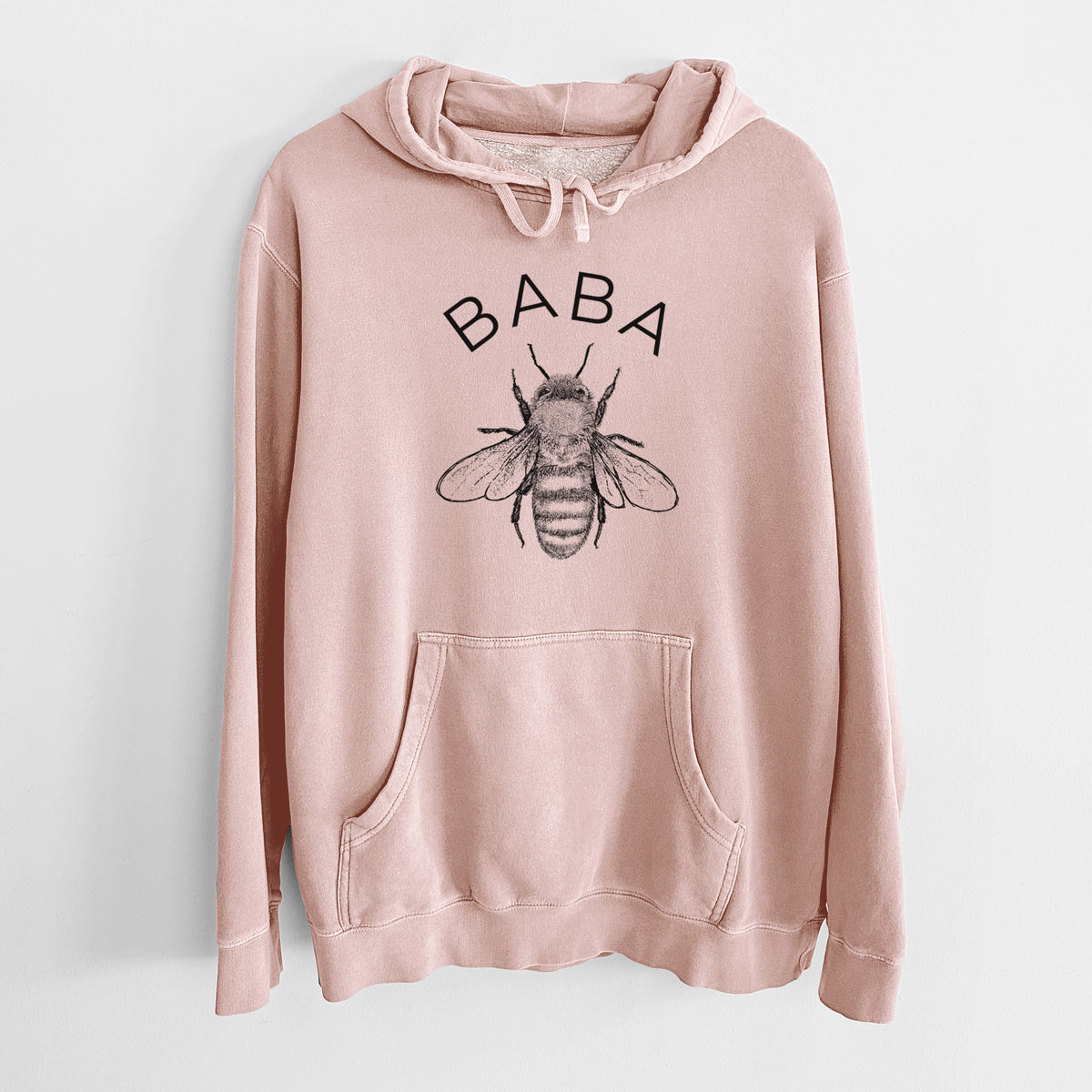 Dusty pink pigment dyed hoodie laid flat, printed with a black ink honey bee beneath the word Baba.