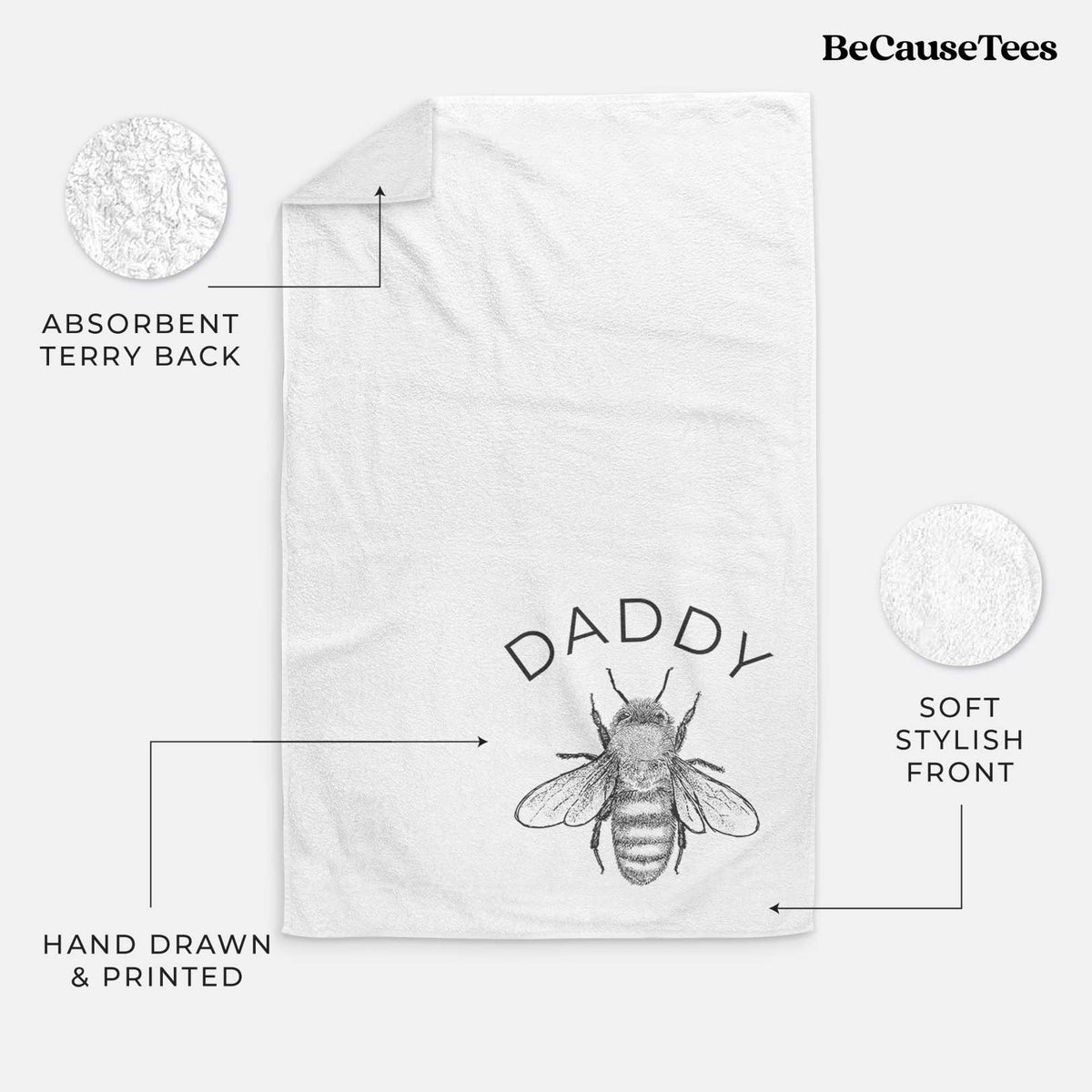 White hand towel printed with a black ink honey bee beneath the word Daddy.