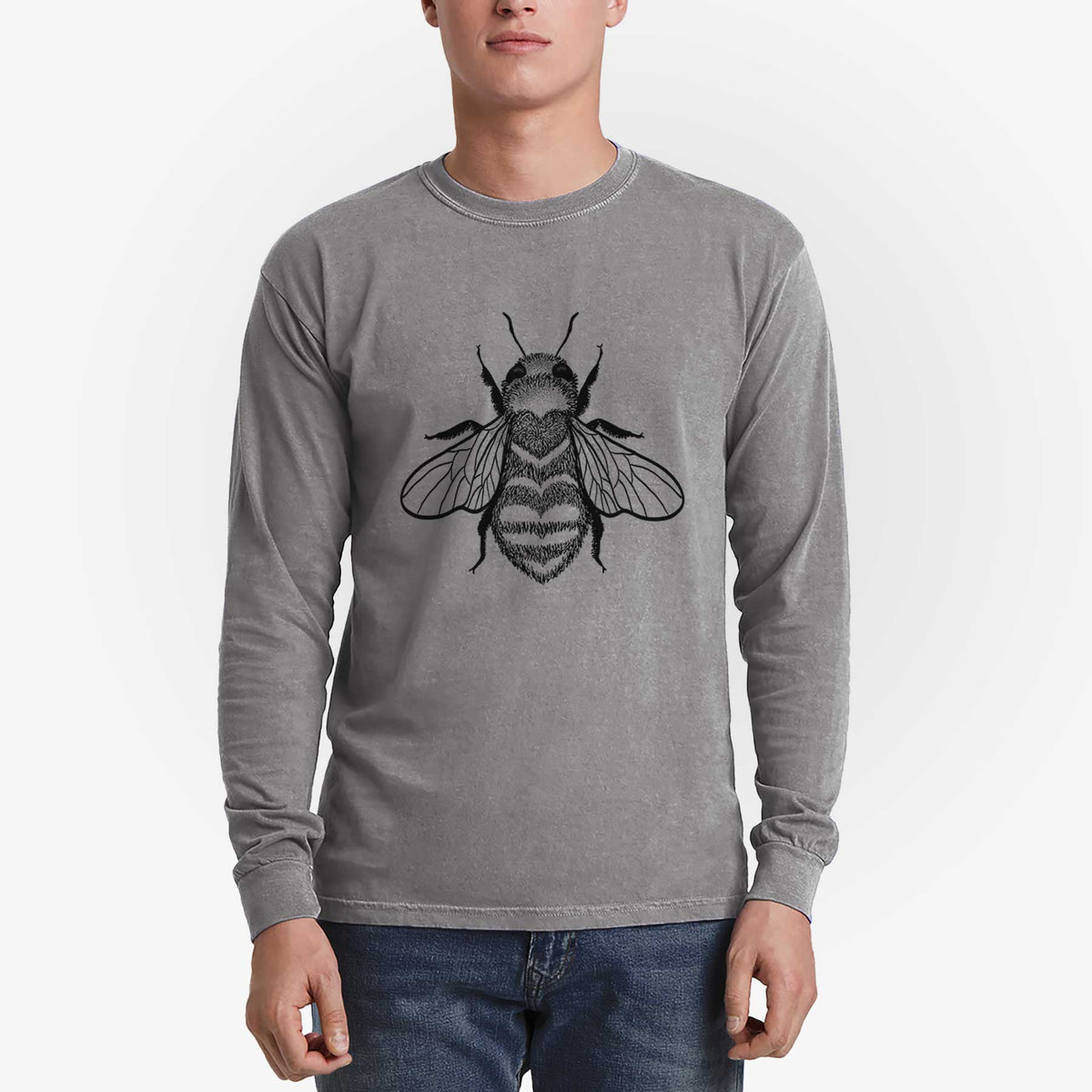 Man wearing a grey Comfort Colors long sleeve shirt printed with a black ink bee with a heart pattern on its body.